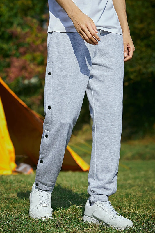 Light gray retro joggers for men with button details, perfect for casual wear and outdoor activities. Buy retro joggers for men.
