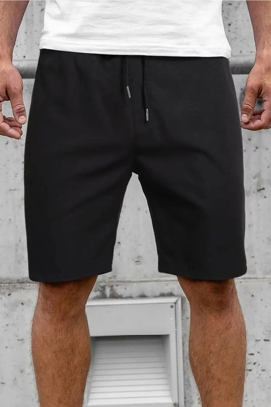 Men wearing stylish black shorts from Dirty Labels, perfect for casual summer outfits. Buy black shorts for men.