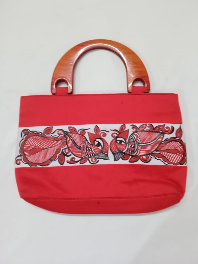 Red silk handbag for women with wooden handles and intricate red and black embroidery