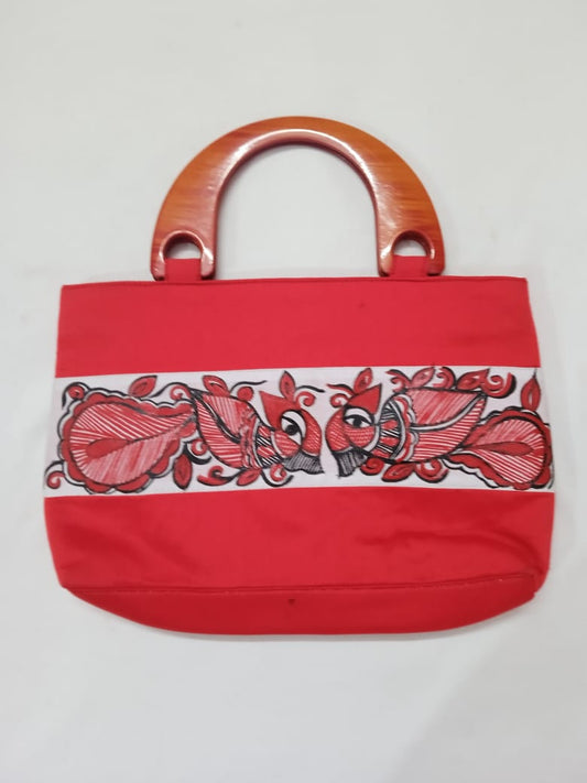 Red silk handbag for women with wooden handles and intricate red and black embroidery