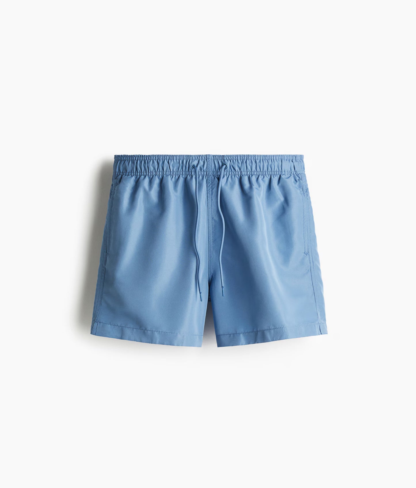 Light blue swimming trunks perfect for summer beachwear for men with adjustable waistband