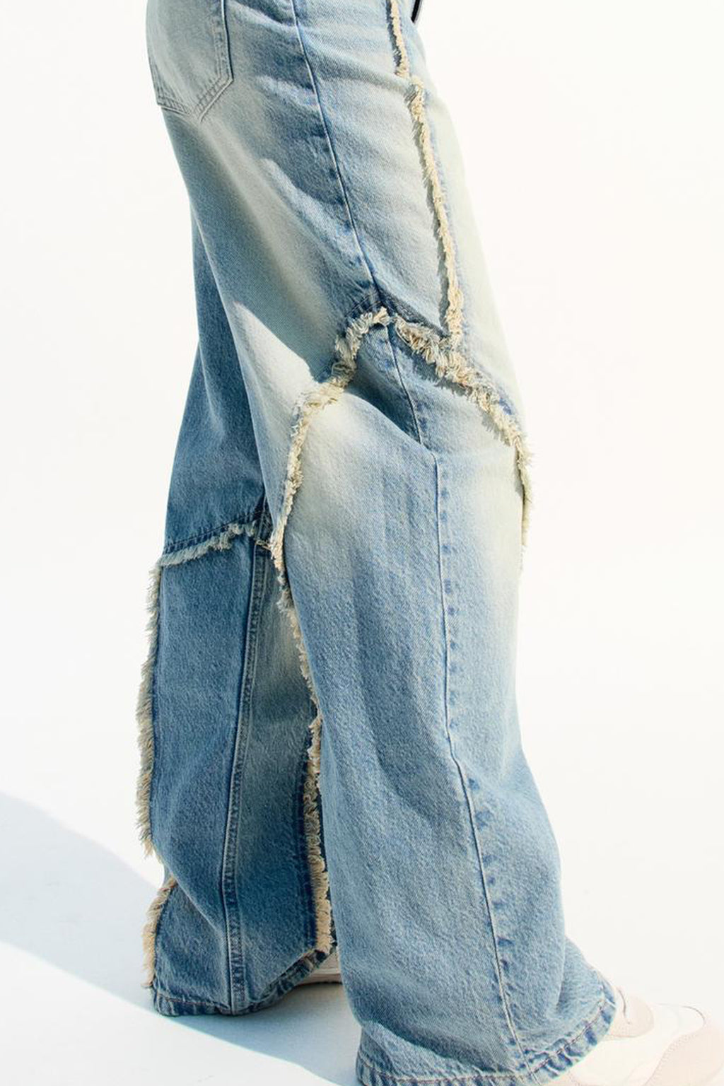 Stylish baggy jeans for women featuring a distressed design and wide-leg fit