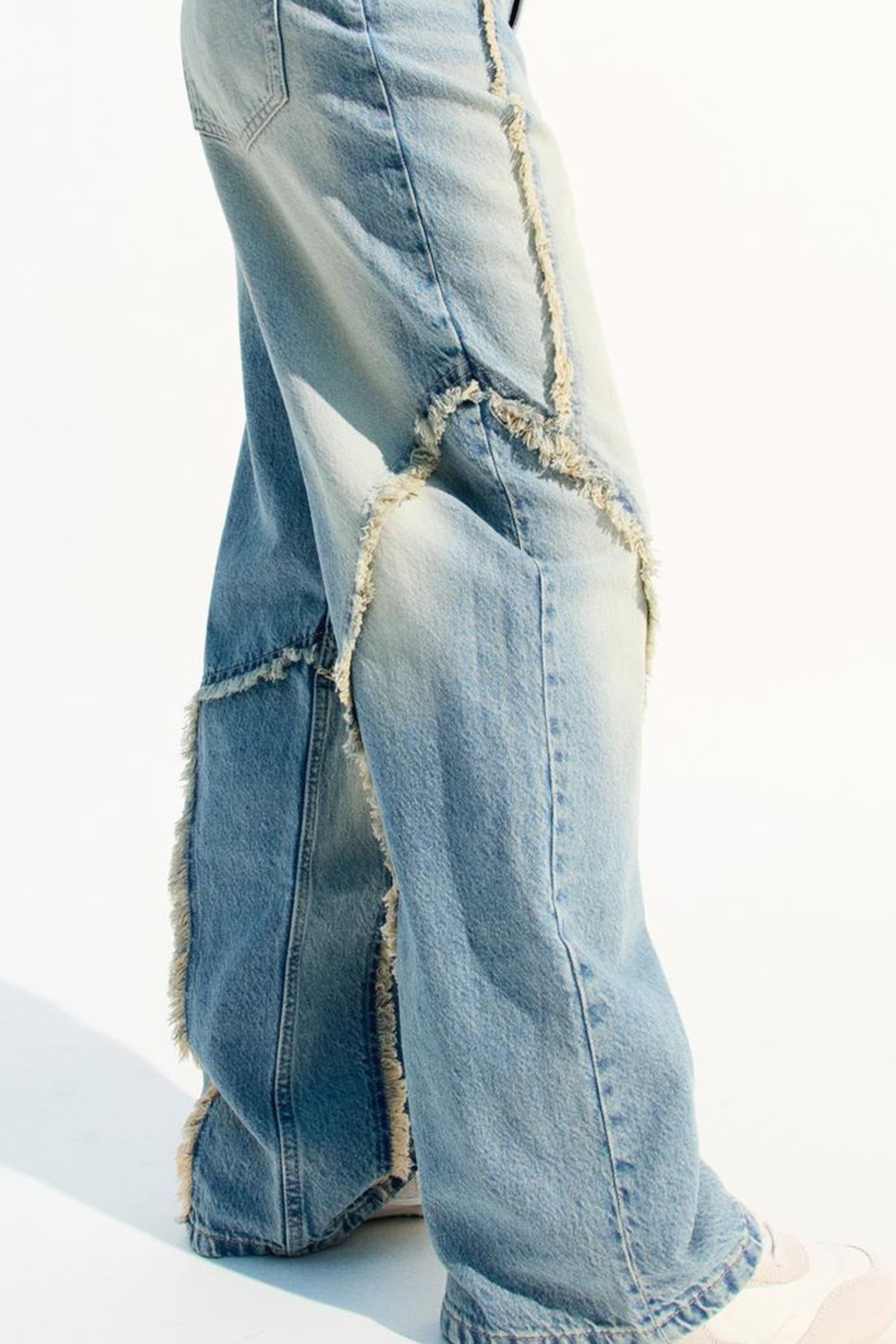 Stylish baggy jeans for women featuring a distressed design and wide-leg fit