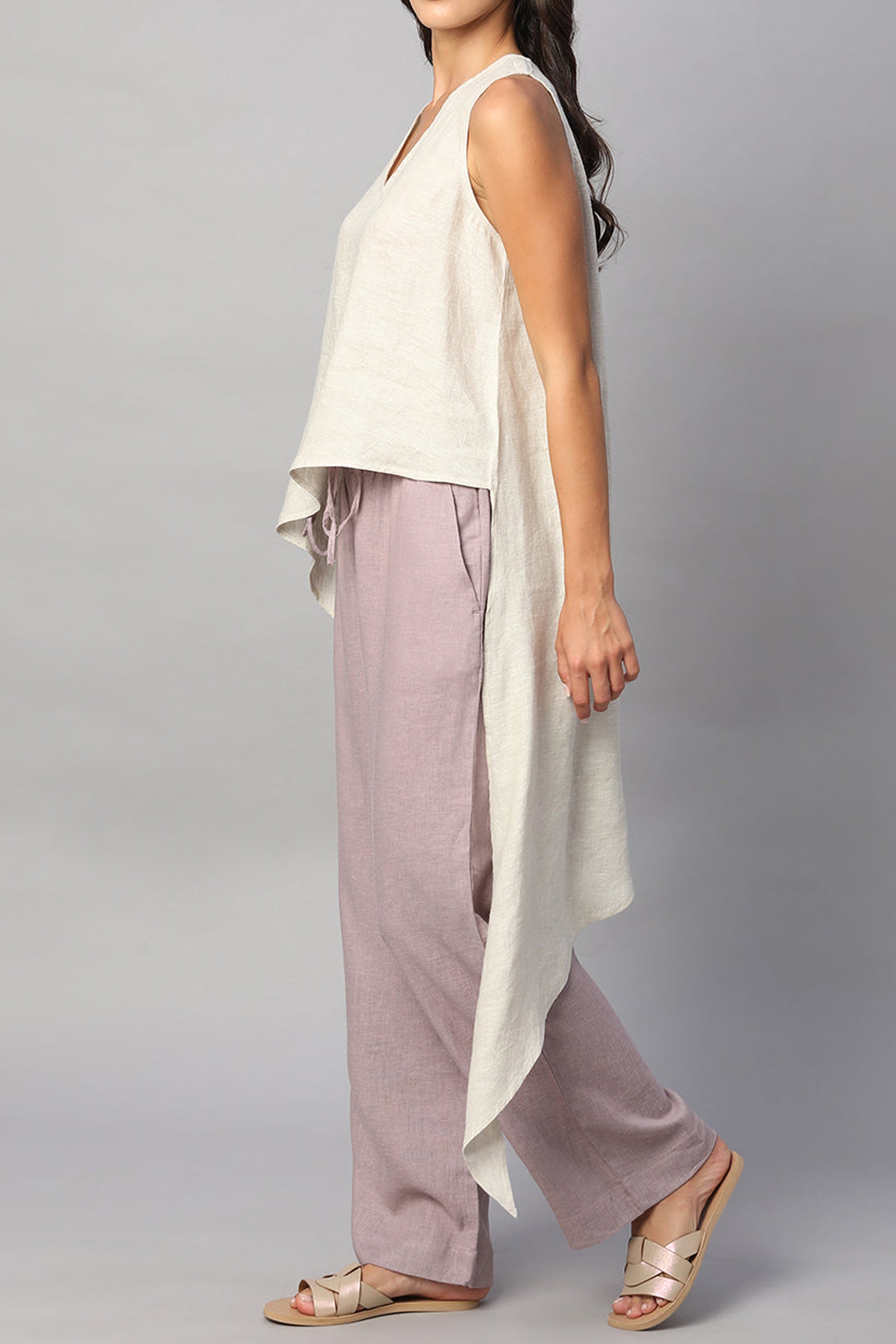 Beige summer top for women with a flowy design, paired with light pink wide-leg pants for a stylish look