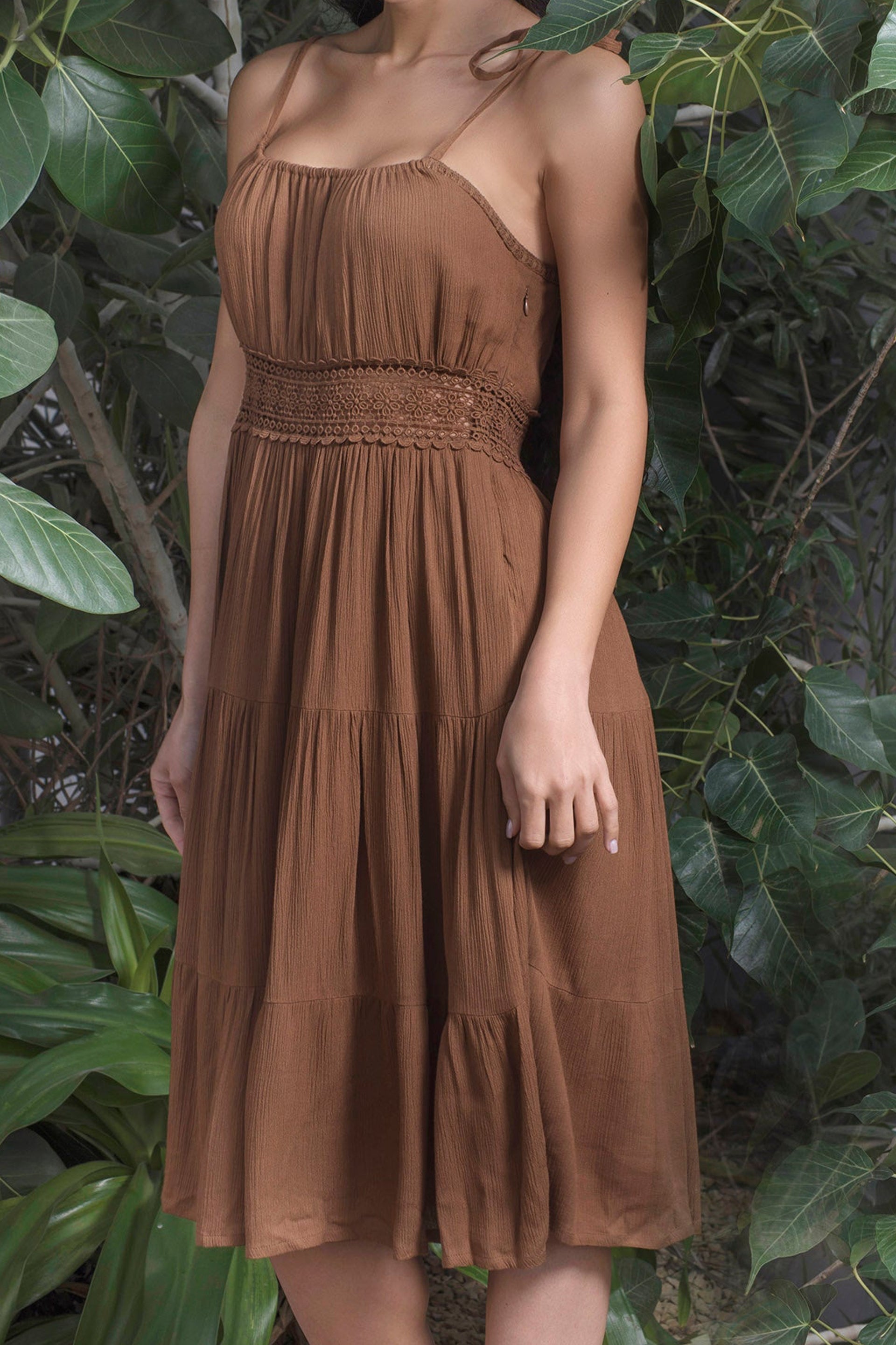 Brown boho chic lace dress with a smocked bodice and flowy skirt for a stylish summer look