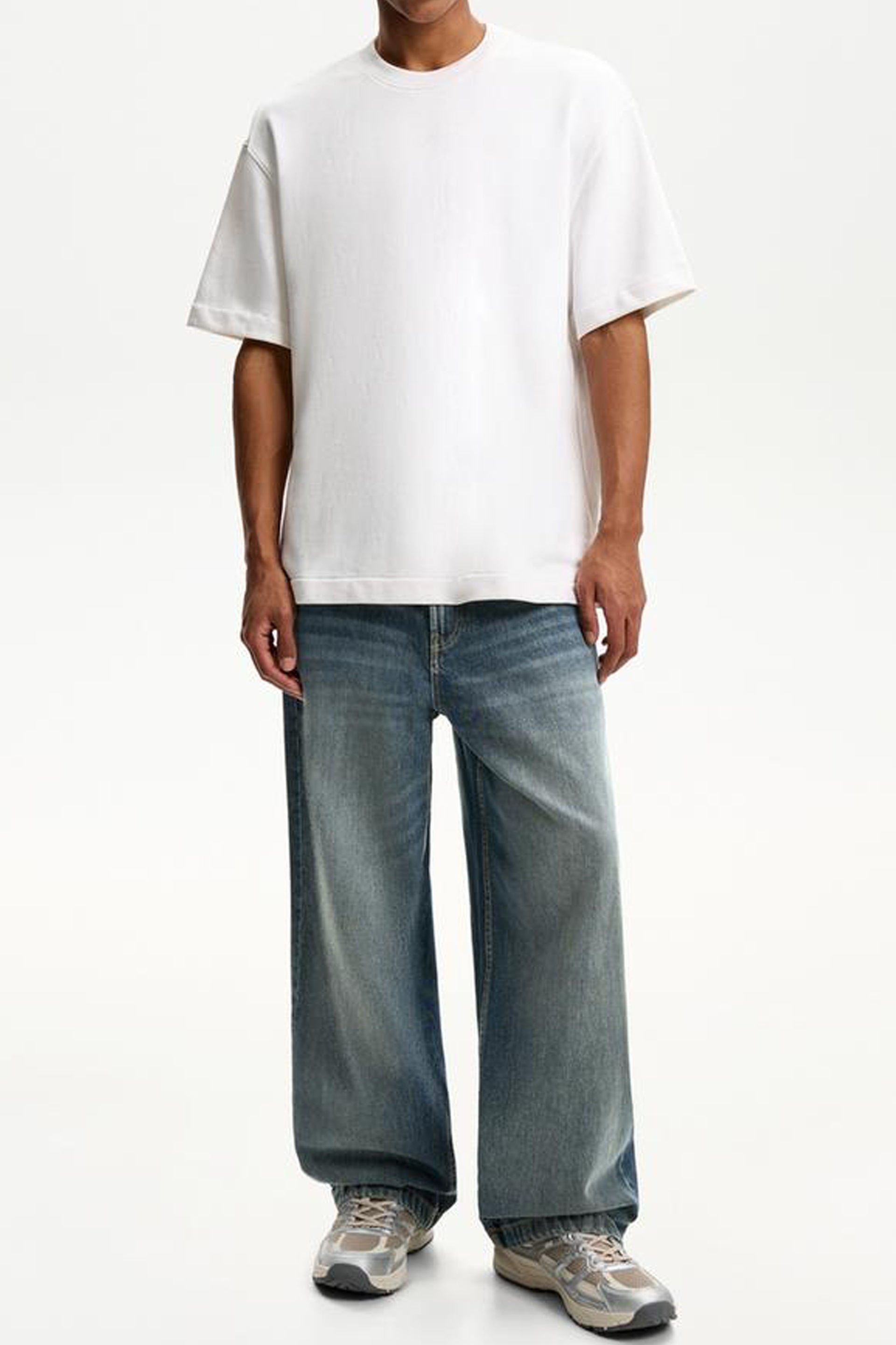 Men's super baggy jeans for men featuring a relaxed fit and worn denim wash