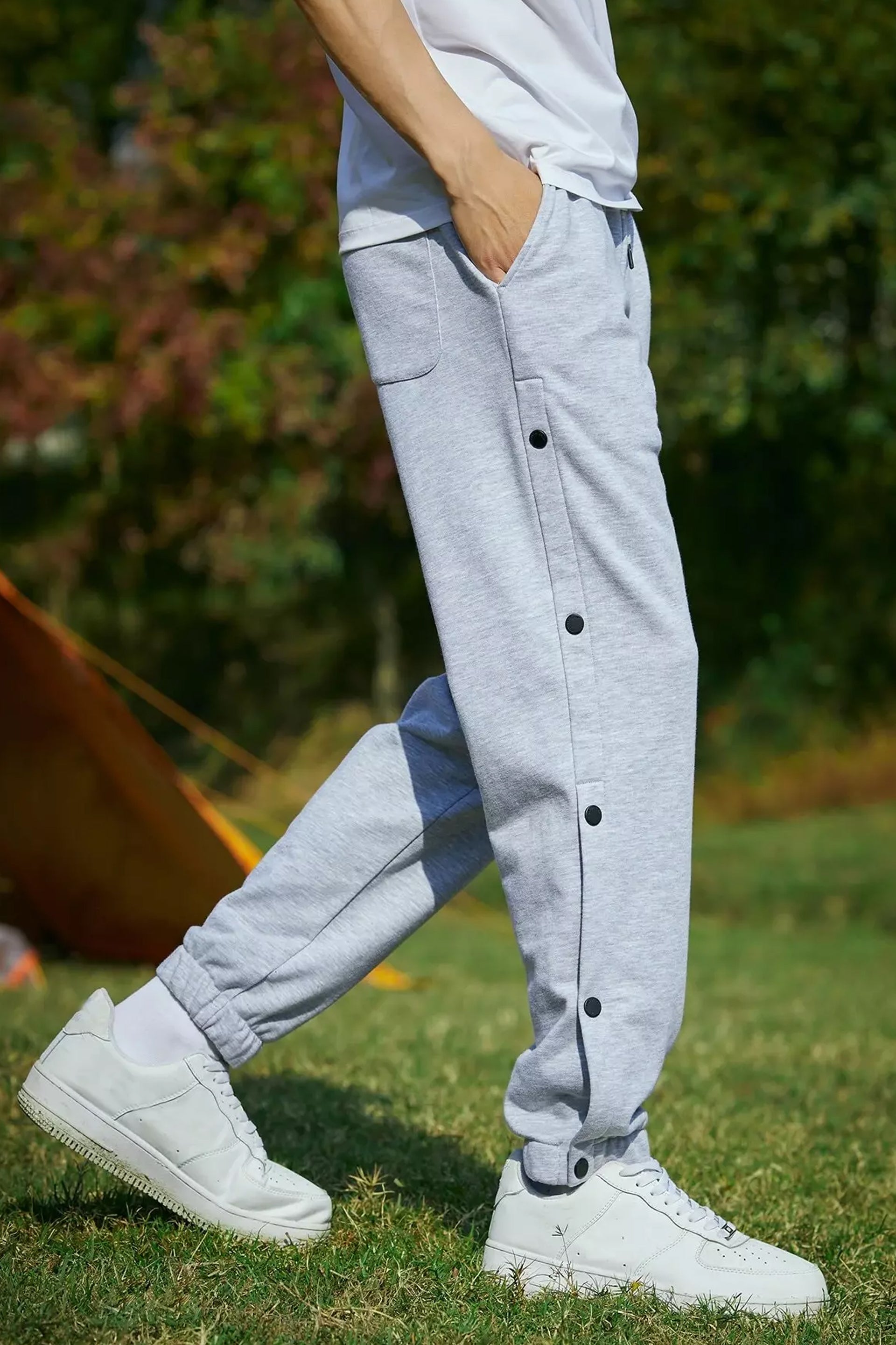 Men wearing gray retro joggers with button details for casual style. Buy retro joggers for men.