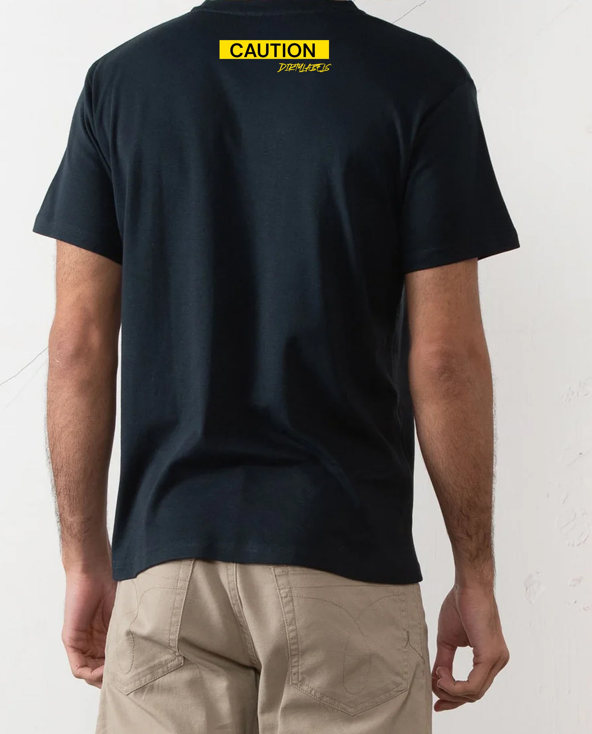 Back view of a casual black tee for men featuring a bold yellow caution graphic