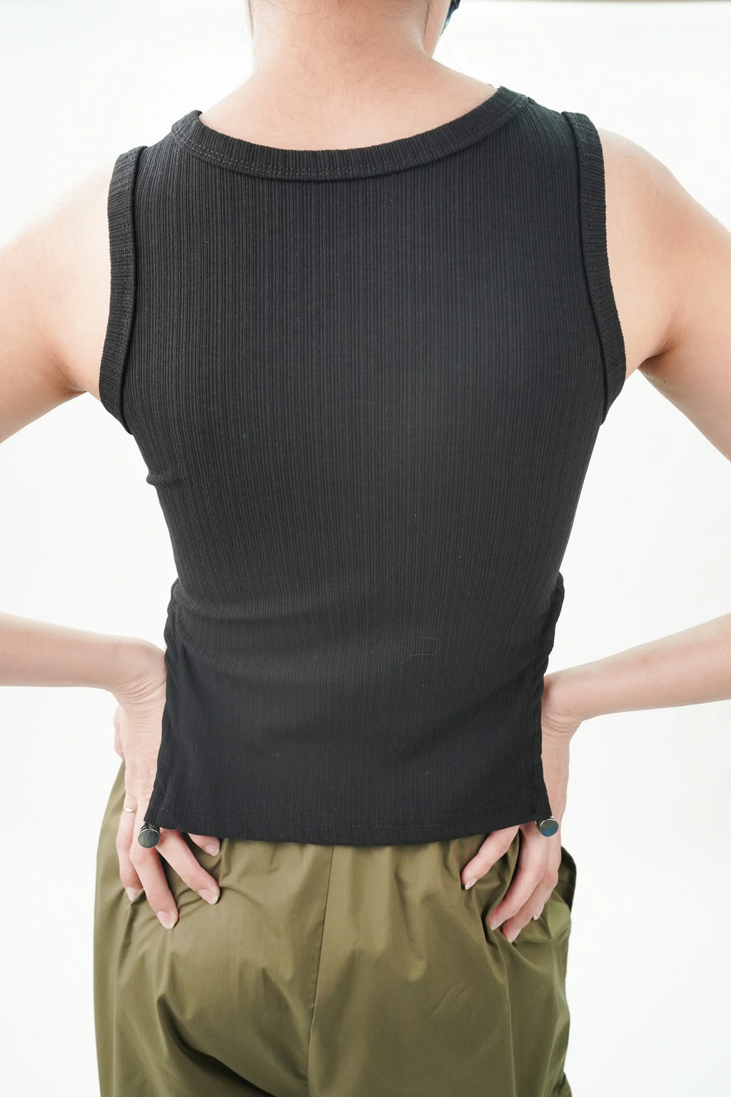 Casual black top for women with ribbed texture and fitted design, perfect for everyday wear