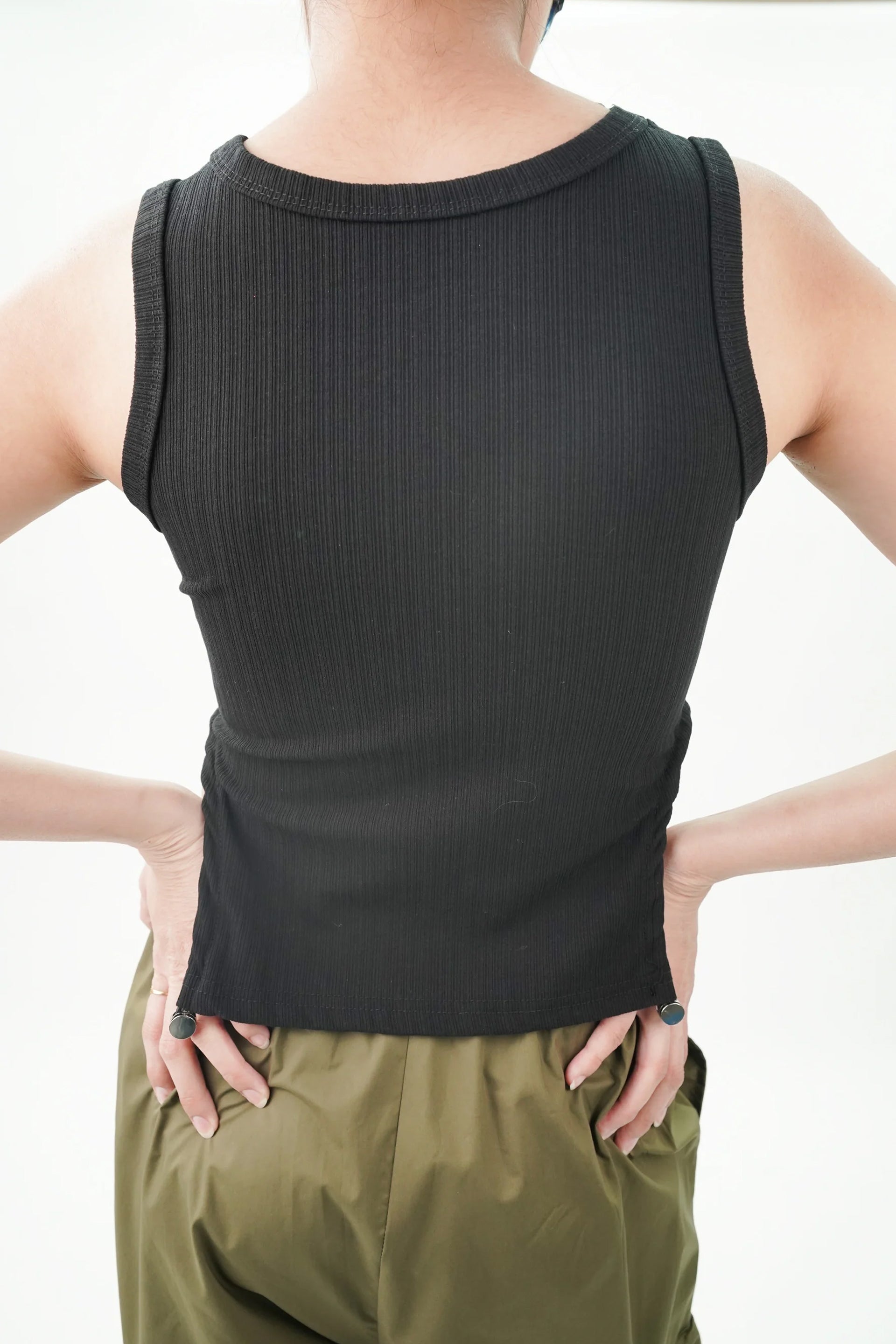 Casual black top for women with ribbed texture and fitted design, perfect for everyday wear