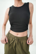Casual black top for women with adjustable drawstrings and ribbed fabric for a comfortable fit