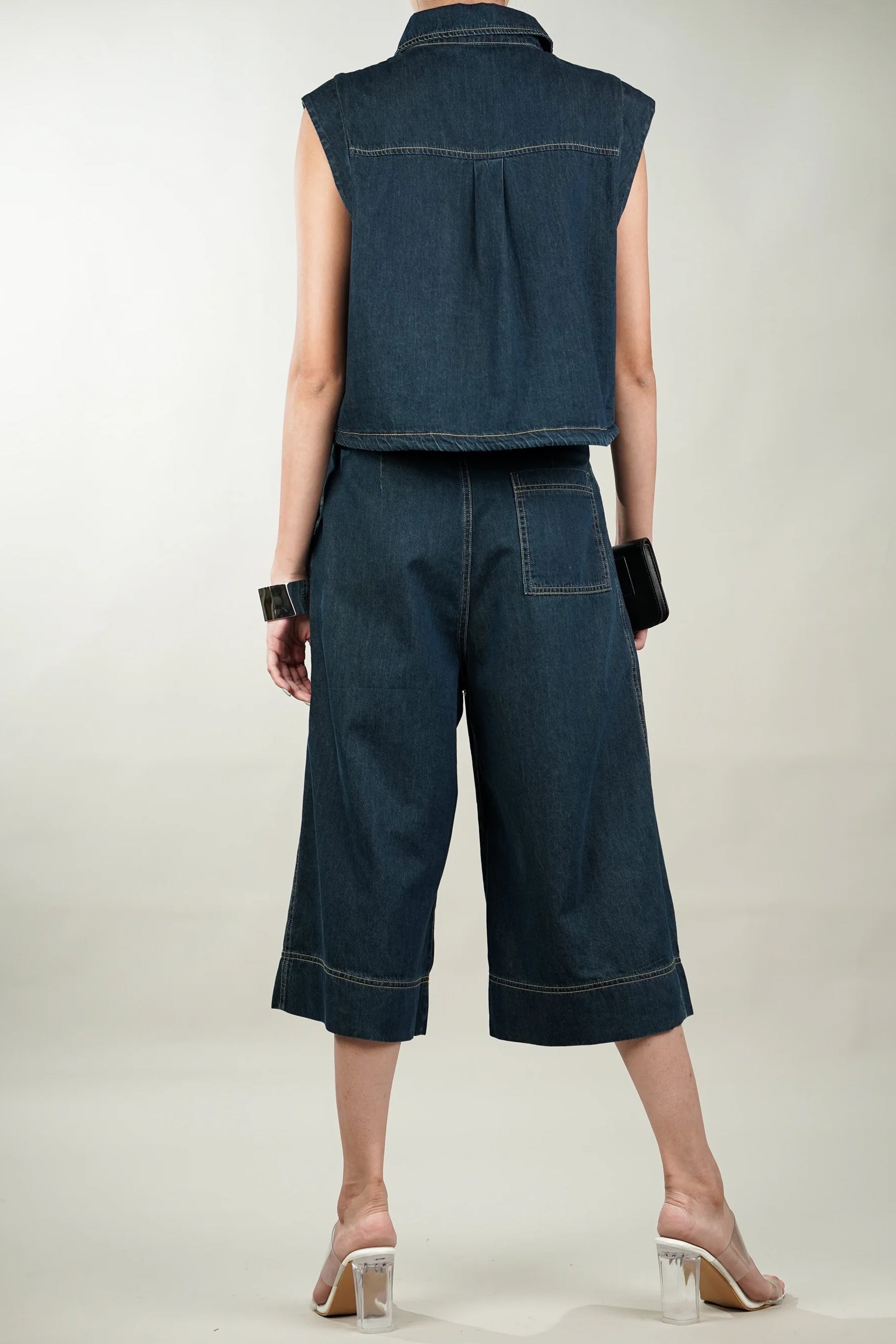 Back view of a cotton denim coord set featuring a sleeveless top and wide-leg culottes