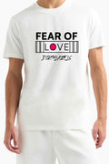 Fear Of Love graphic t-shirt in white featuring bold black text and a pink accent for a trendy look