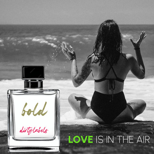 Dirtylabels Bold luxury fragrance online in a stylish bottle with a beach backdrop