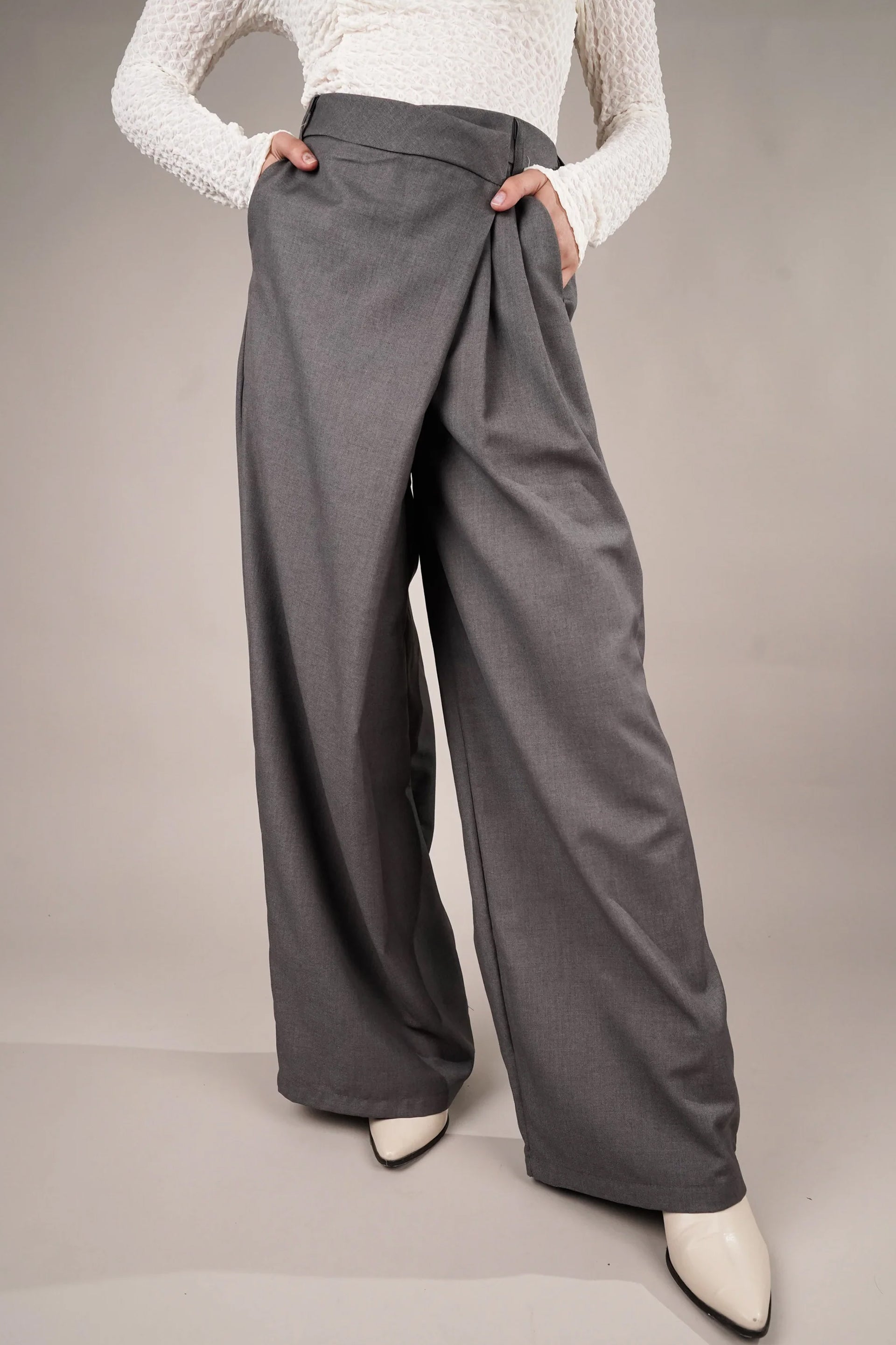 Draped asymmetrical pants online in grey with a wide-leg silhouette and stylish draping detail