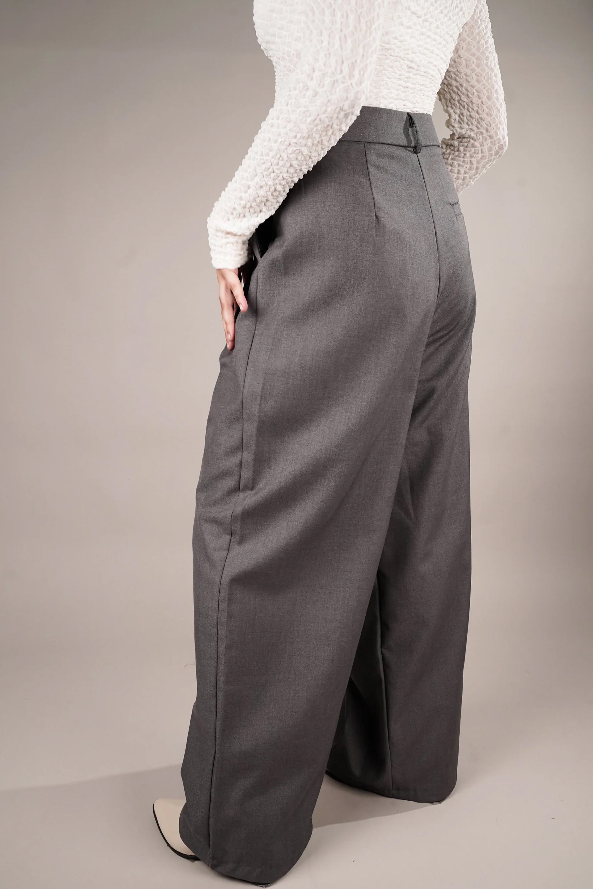 Draped asymmetrical pants online in gray, showcasing a wide-leg design and tailored fit from Dirtylabels