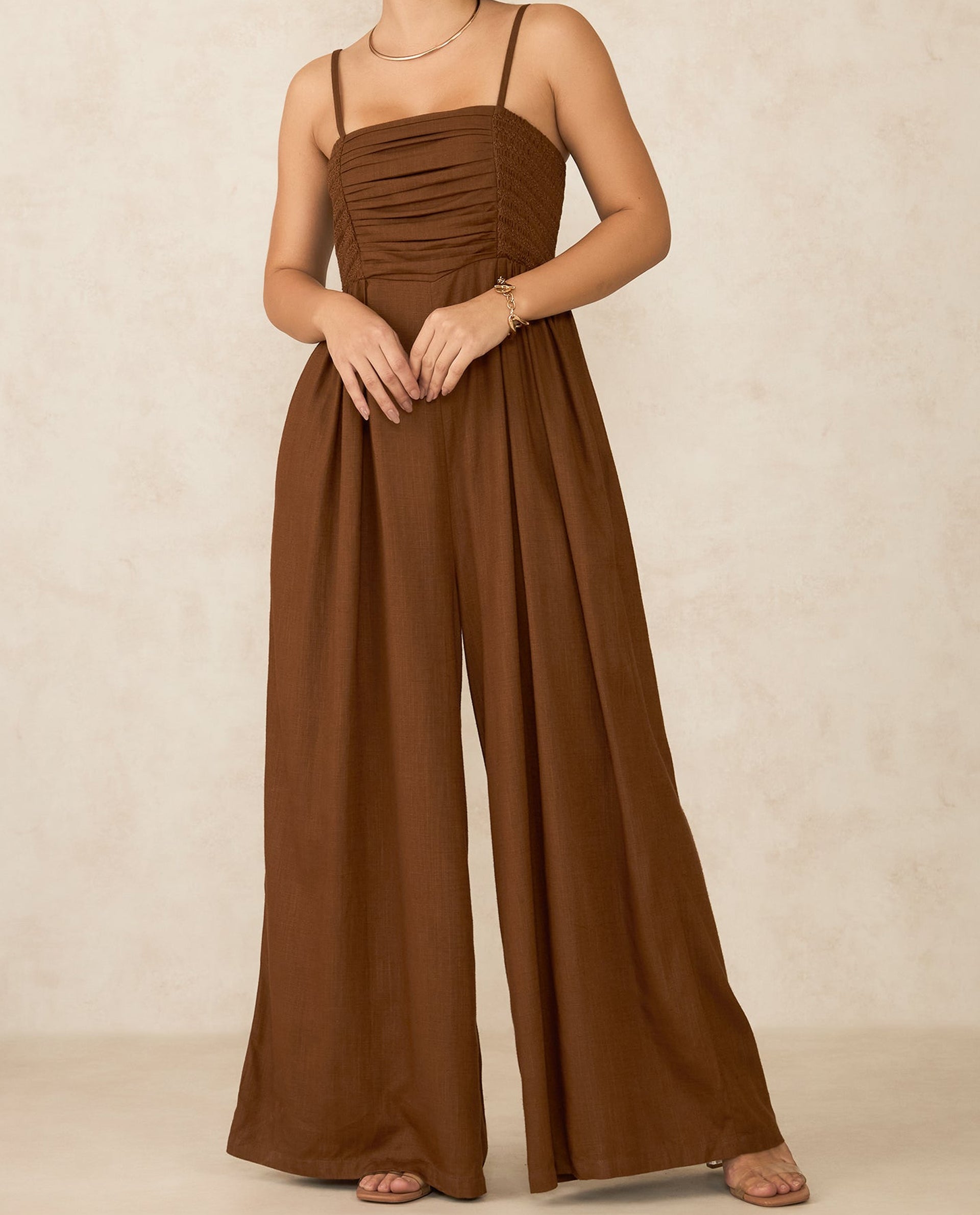 Elegant jumpsuit for parties in rich brown with a stylish strapless design and flowing wide legs
