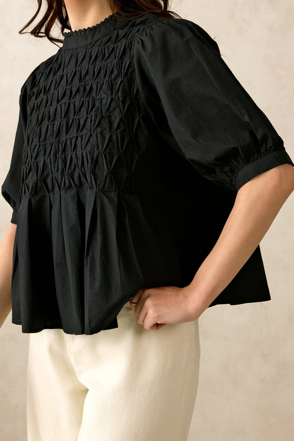 Black smocked fashion top for women India with stylish puff sleeves and relaxed fit