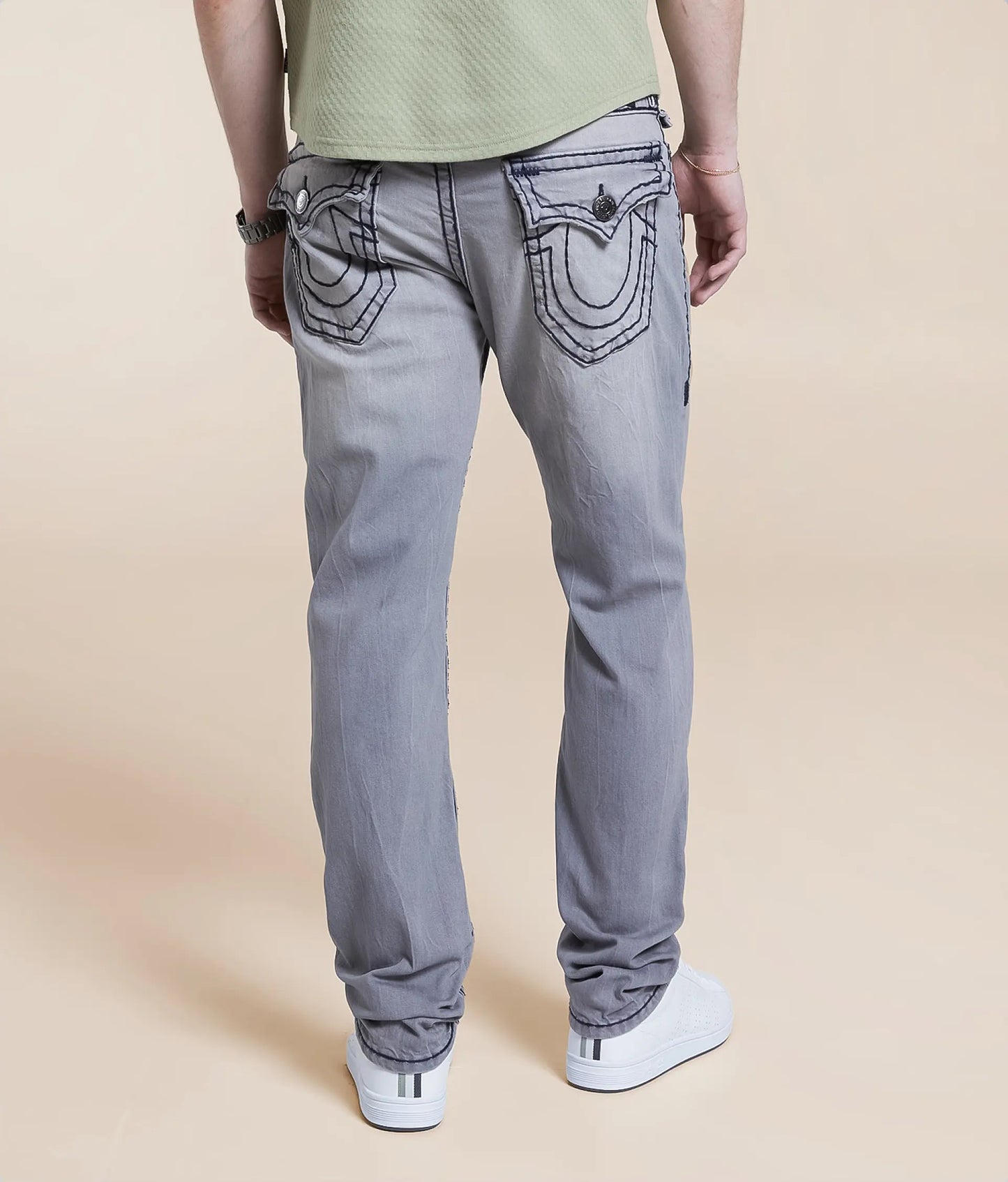 Grey Relaxed Skinny Jeans with unique back pocket detailing and comfortable fit for everyday wear