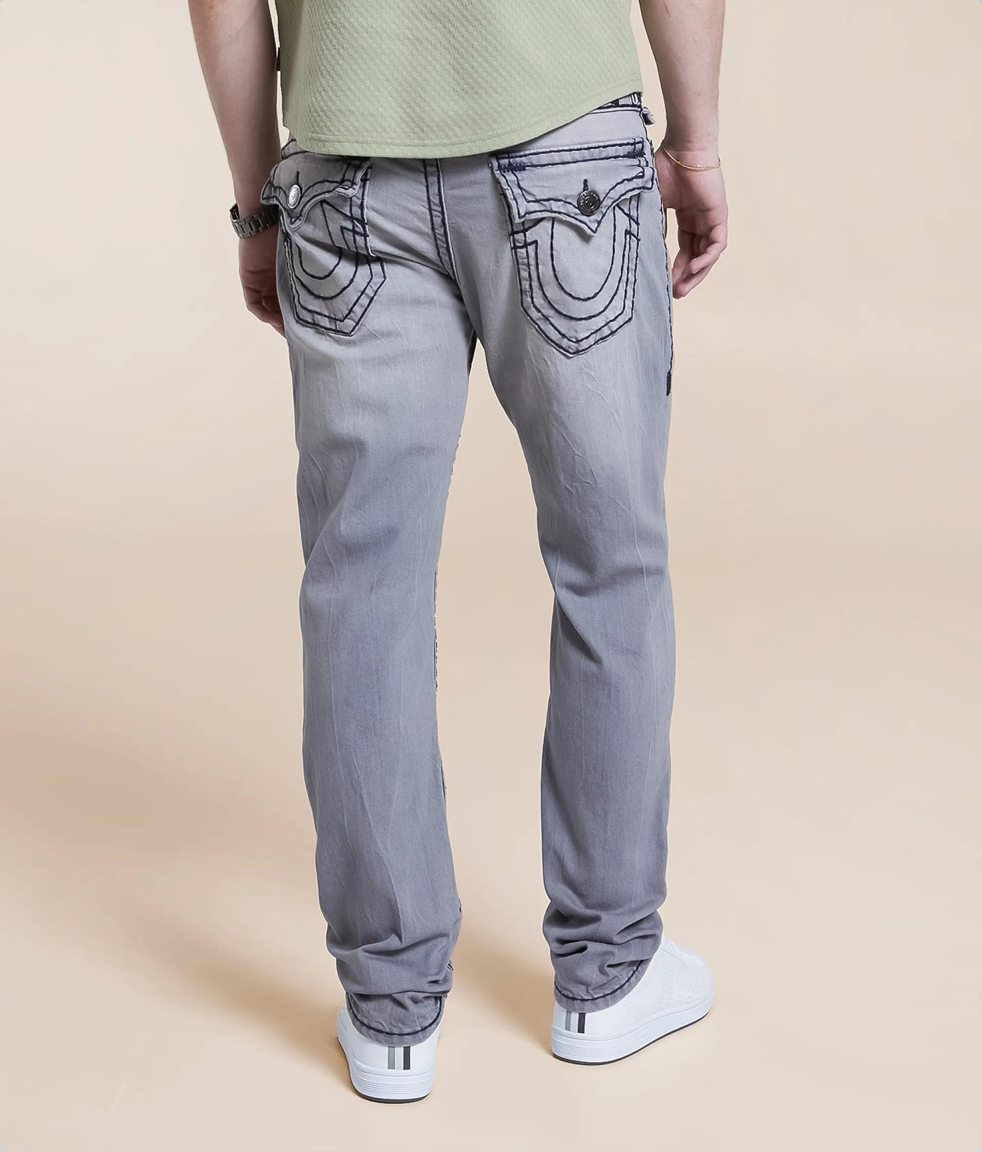 Grey Relaxed Skinny Jeans with unique back pocket detailing and comfortable fit for everyday wear