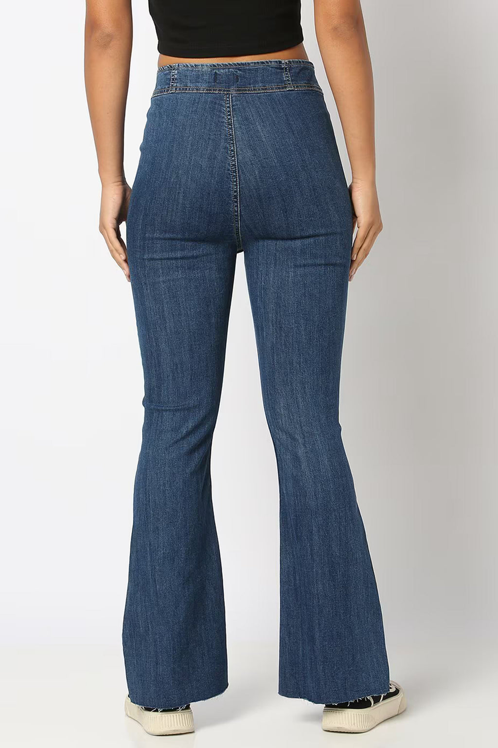 Back view of high-rise bootcut jeans for women in dark denim with a flattering fit