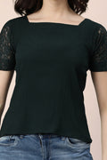Elegant Indian fashion lace blouse in dark green with short lace sleeves and a square neckline