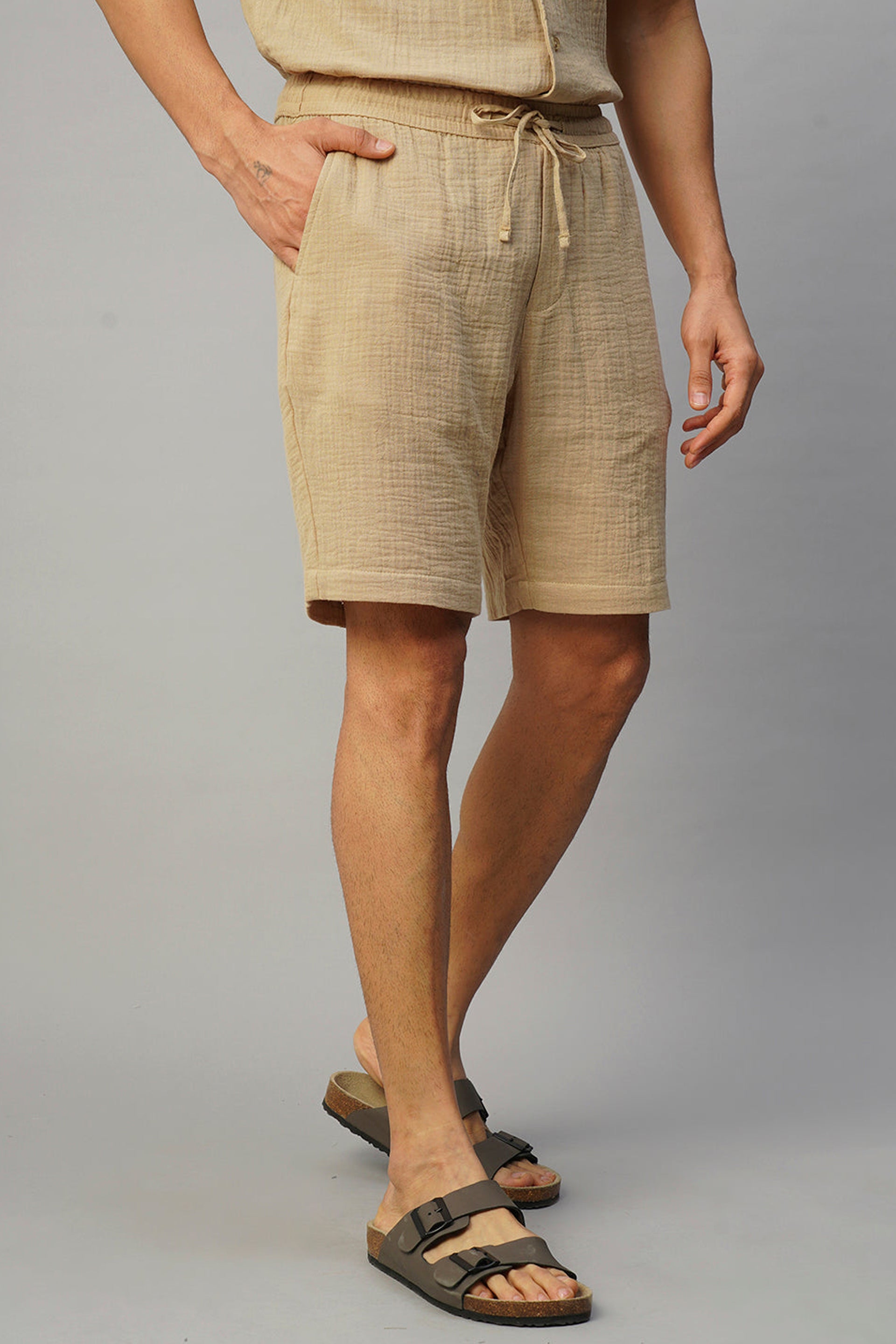 Stylish khaki cotton shorts for men with an adjustable drawstring waist and pockets