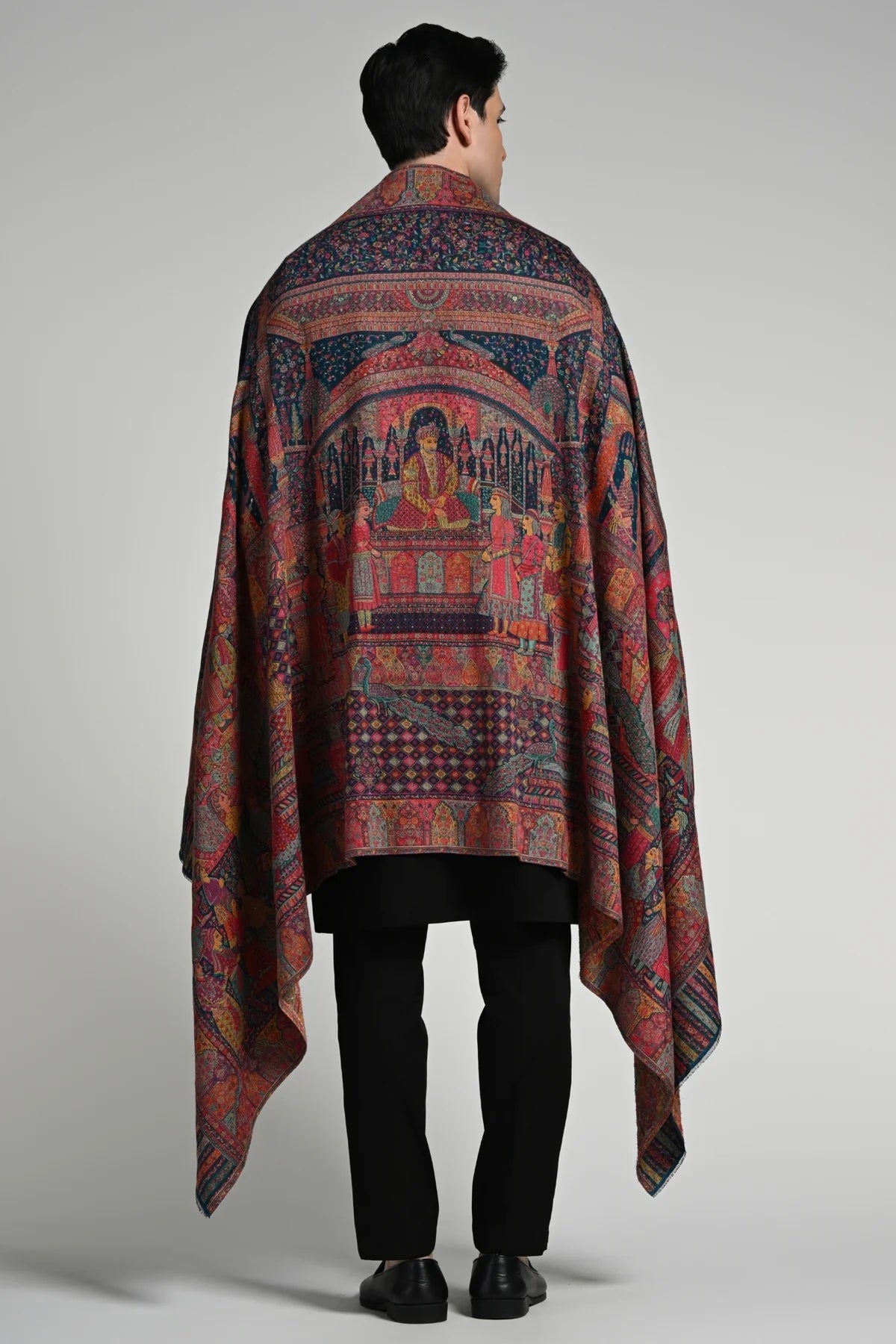 Luxury ethnic shawl for winter featuring intricate patterns and rich colors, suitable for elegant layering