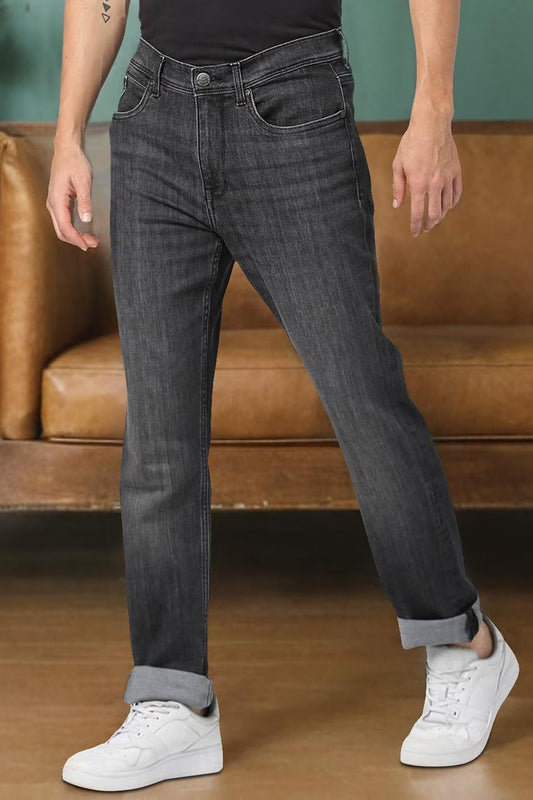 Men's straight jeans India in dark grey, styled with rolled cuffs and paired with white sneakers