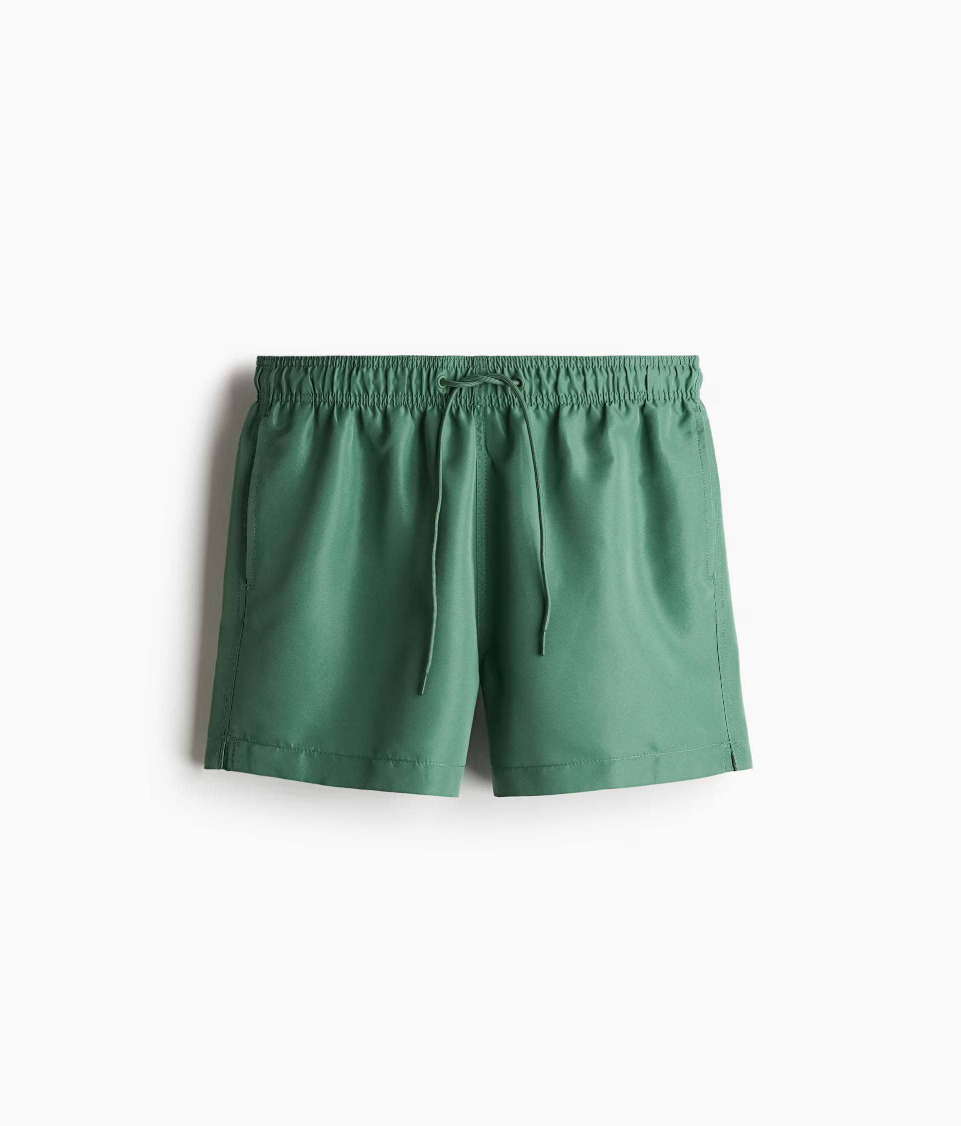 Men's swimwear India in green color, featuring an elastic waistband and drawstring closure