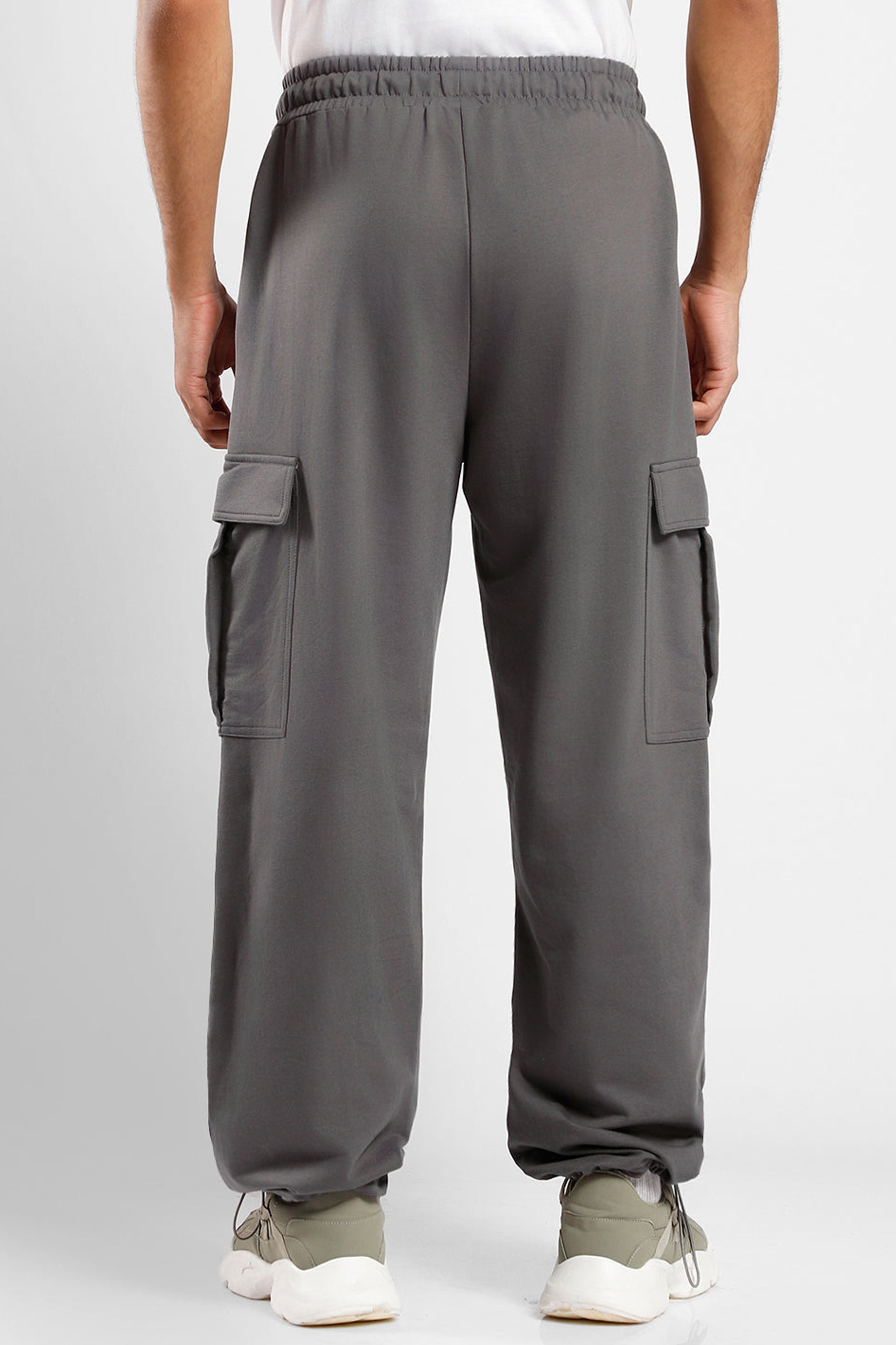 Men's oversized cargo joggers in gray with utility pockets and elastic waistband for comfort