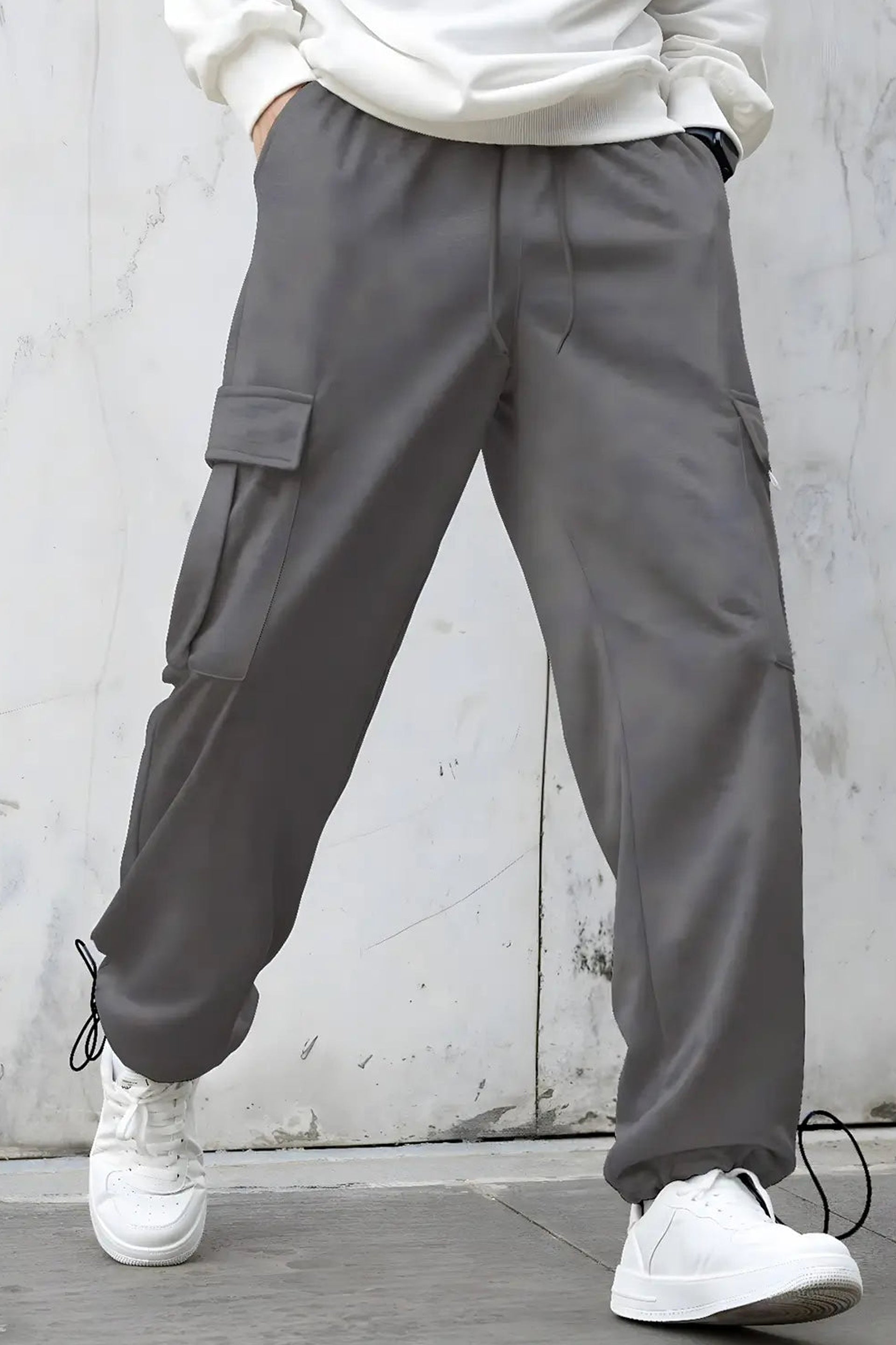 Stylish oversized cargo joggers for men in gray with side pockets and drawstring cuffs