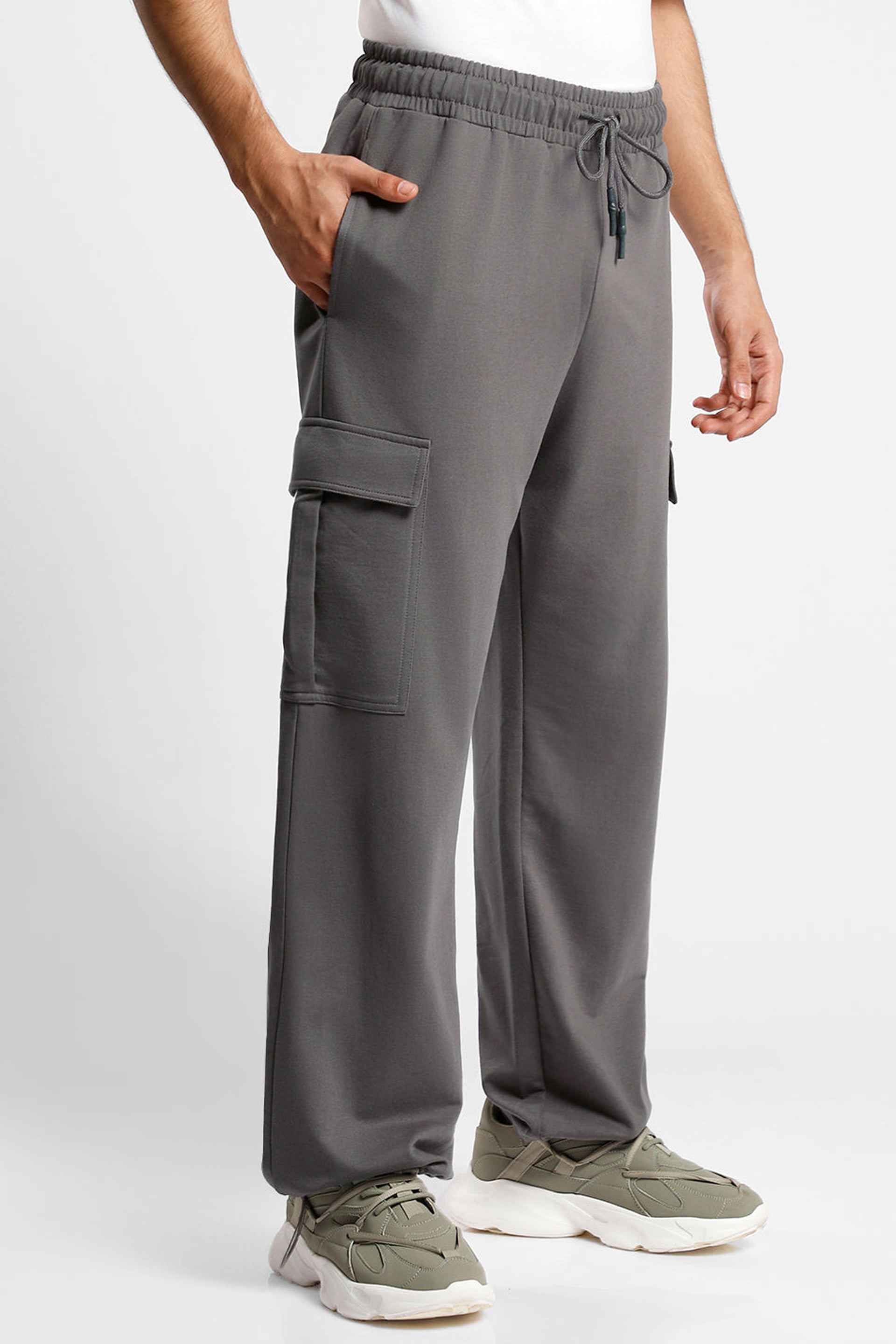 Gray oversized cargo joggers for men featuring side pockets and a comfortable elastic waistband