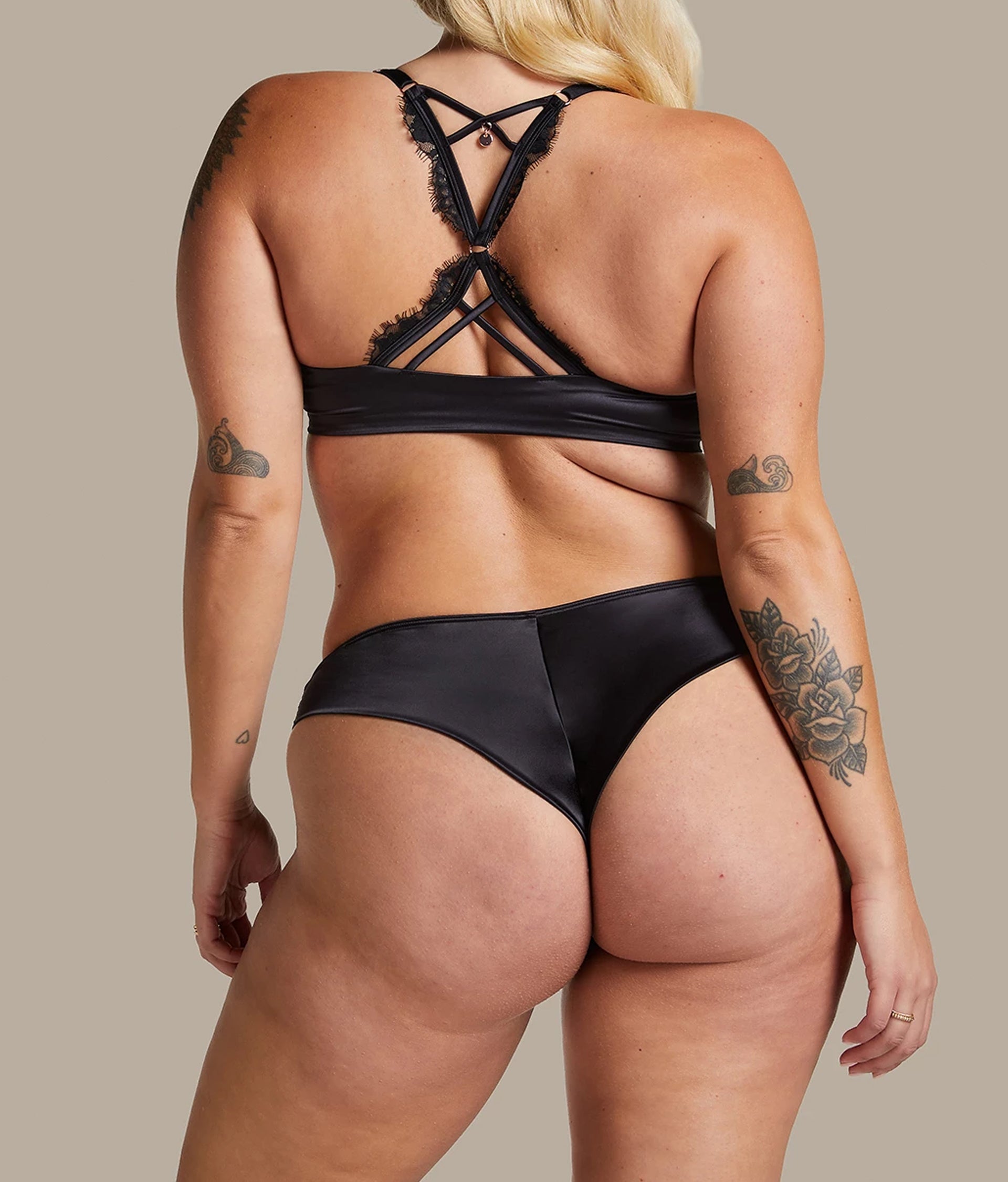 Elegant black padded push-up bra India with intricate lace detailing and stylish crossover straps