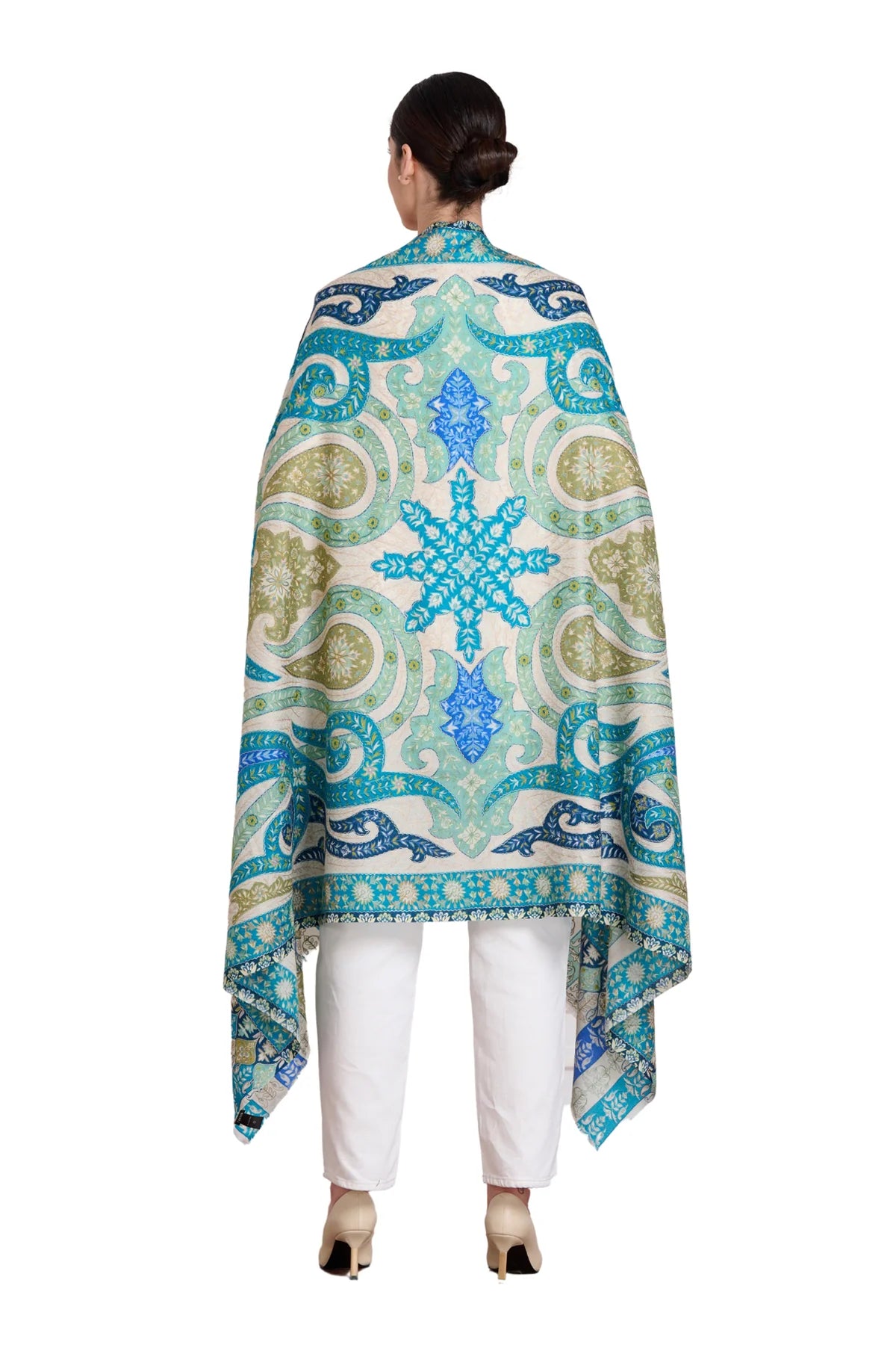 Elegant paisley embroidered kalamkari shawl in vibrant blue and green patterns, worn over a white outfit