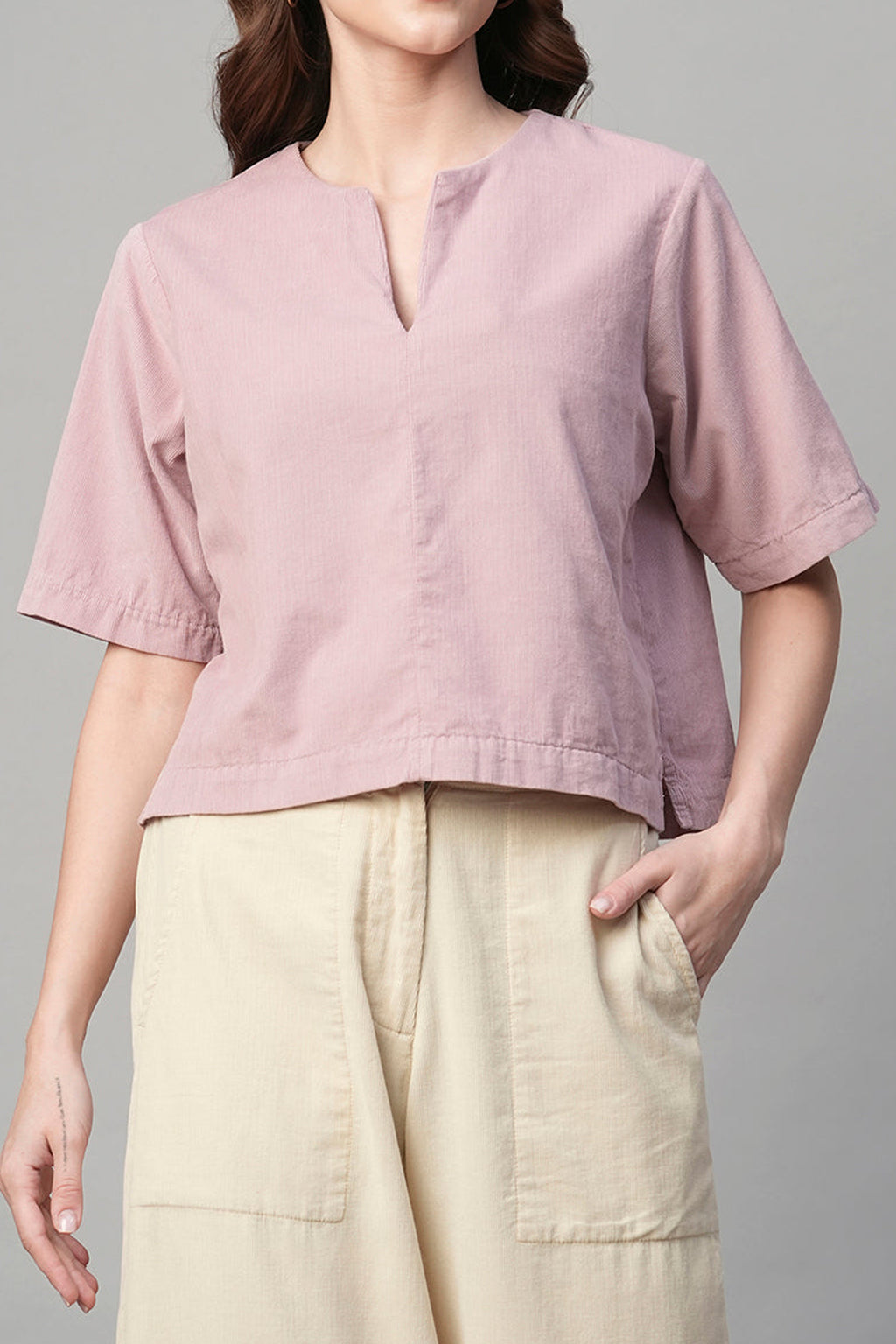 Stylish pink corduroy shirt women with short sleeves, perfect for casual outings