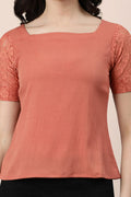 Stylish rose gold lace top with short sleeves and square neckline for a chic look