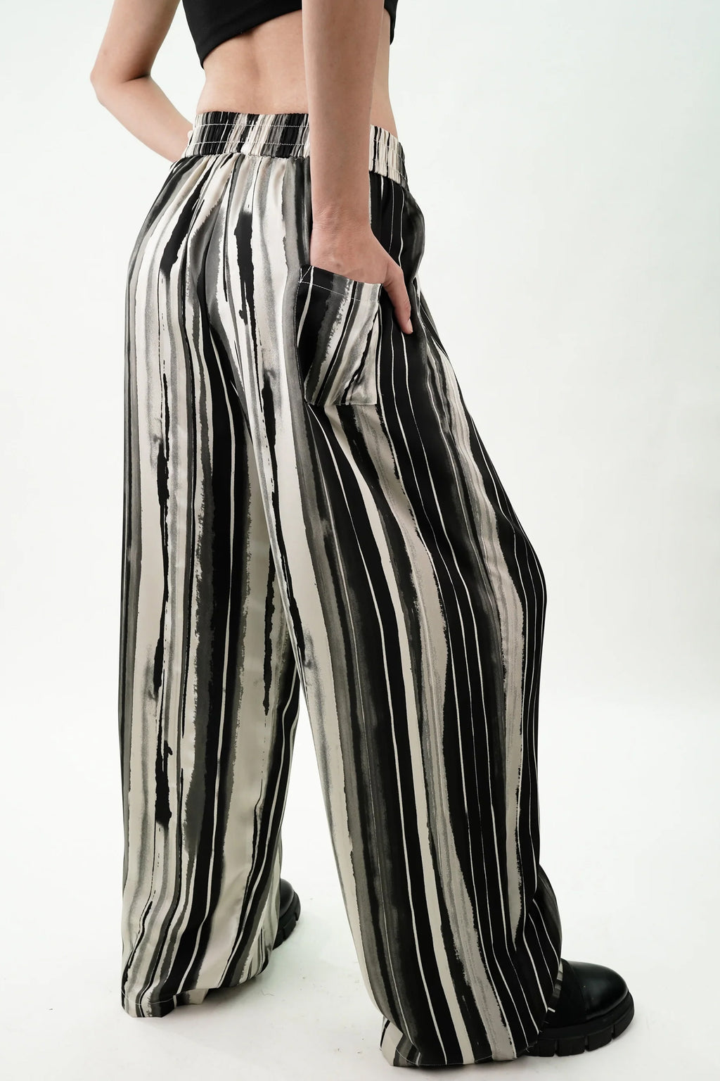 Striped wide leg pants women in black and white with a relaxed fit and side pockets