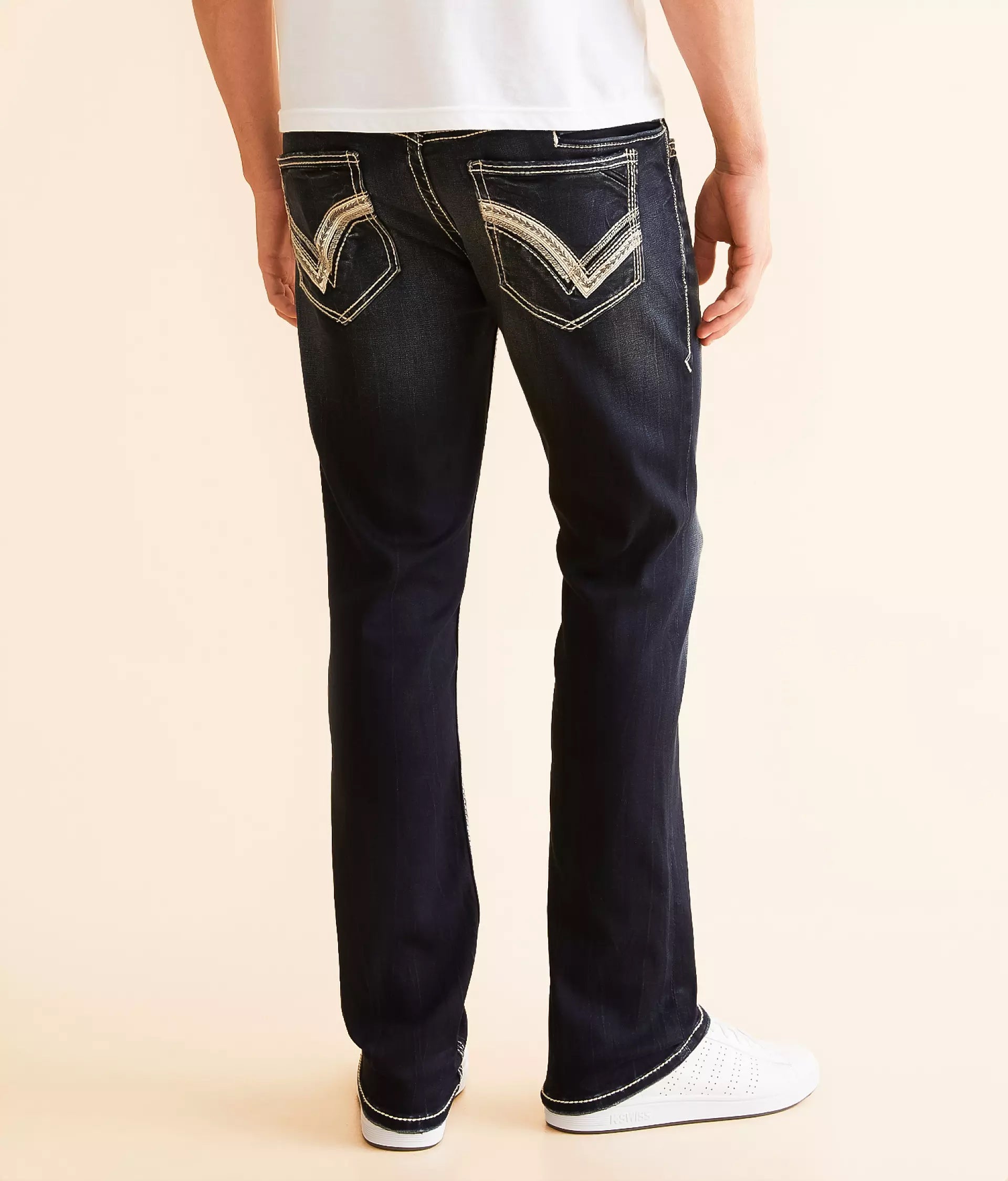 Stylish black jeans for men featuring a modern design and unique back pocket stitching