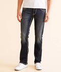 Men wearing stylish black jeans for men with contrast stitching and a slim fit