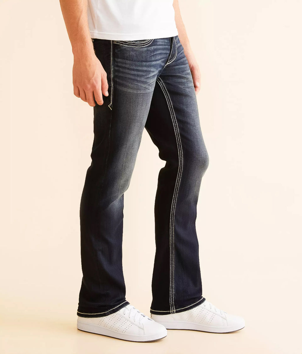 Stylish black jeans for men with a slim fit and contrasting stitching, paired with white sneakers