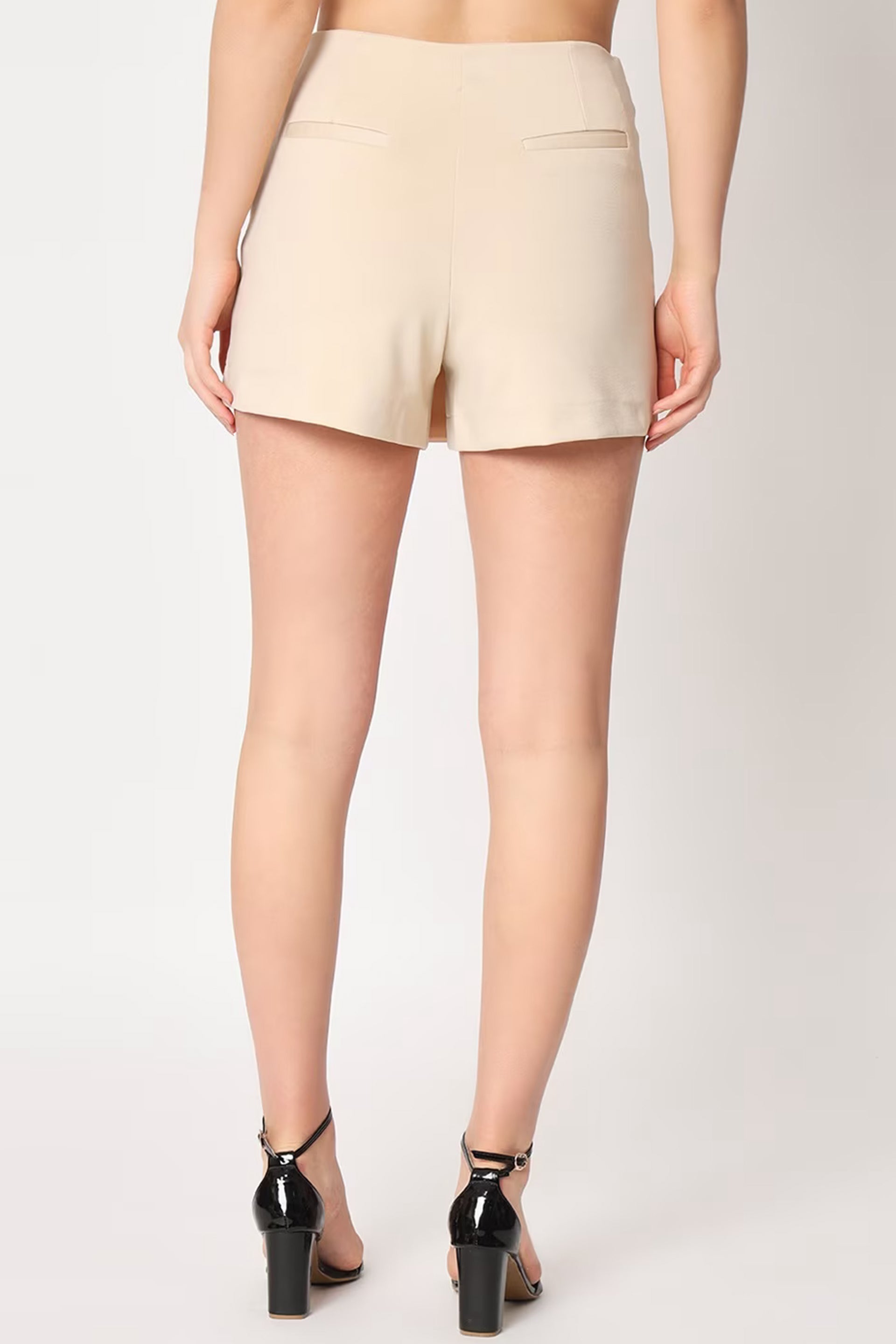 Back view of stylish women's skorts India in beige with sleek design and pockets.
