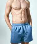 Men's blue swim shorts from Dirtylabels, perfect summer beachwear for men with comfortable fit