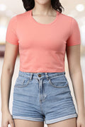 Trendy summer crop tops in coral color, perfect for casual outings and warm weather fashion
