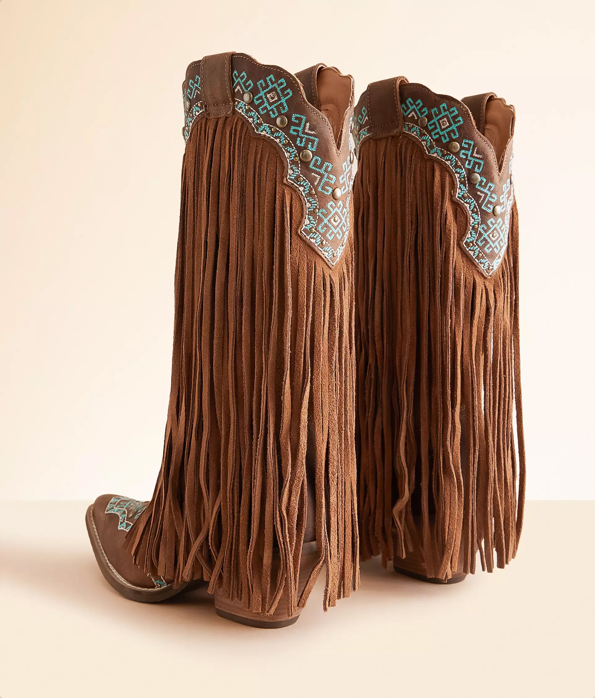 Turquoise leather cowboy boots with fringe detailing and decorative stitching from Dirtylabels