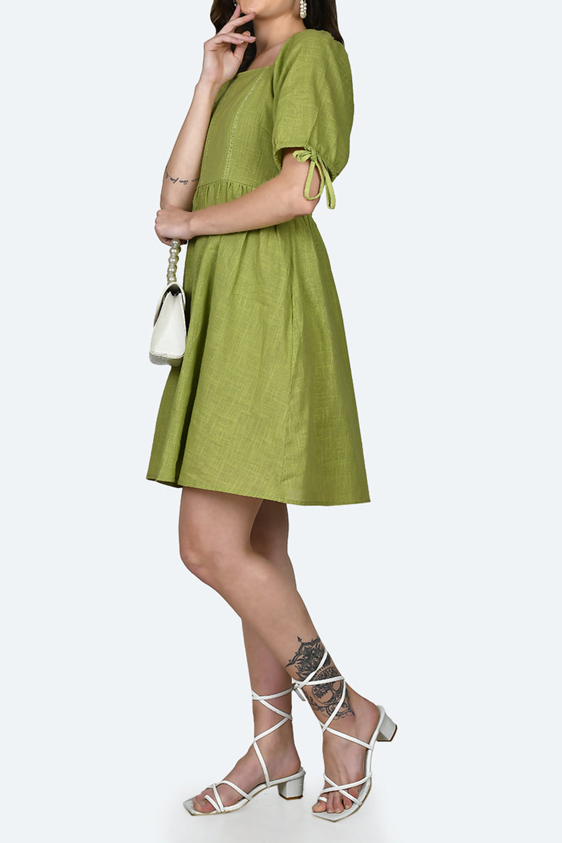 Chic green short dress by Dirtylabels with puff sleeves and a flared skirt for a trendy look