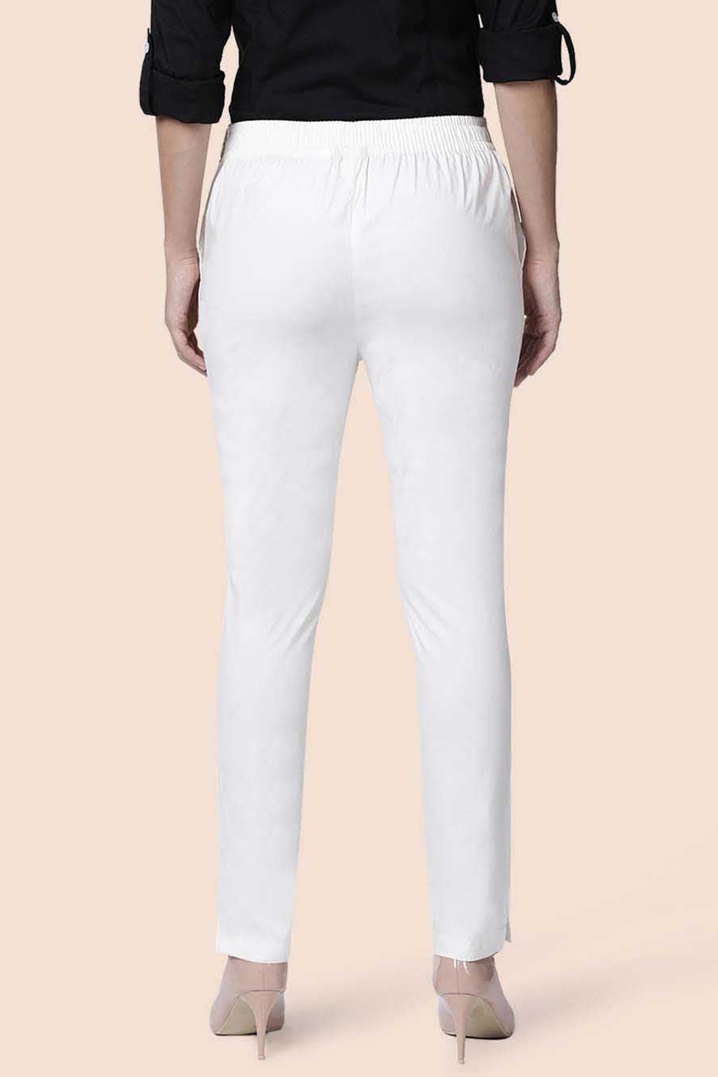Back view of white straight pants for women with an elastic waistband and slim fit style