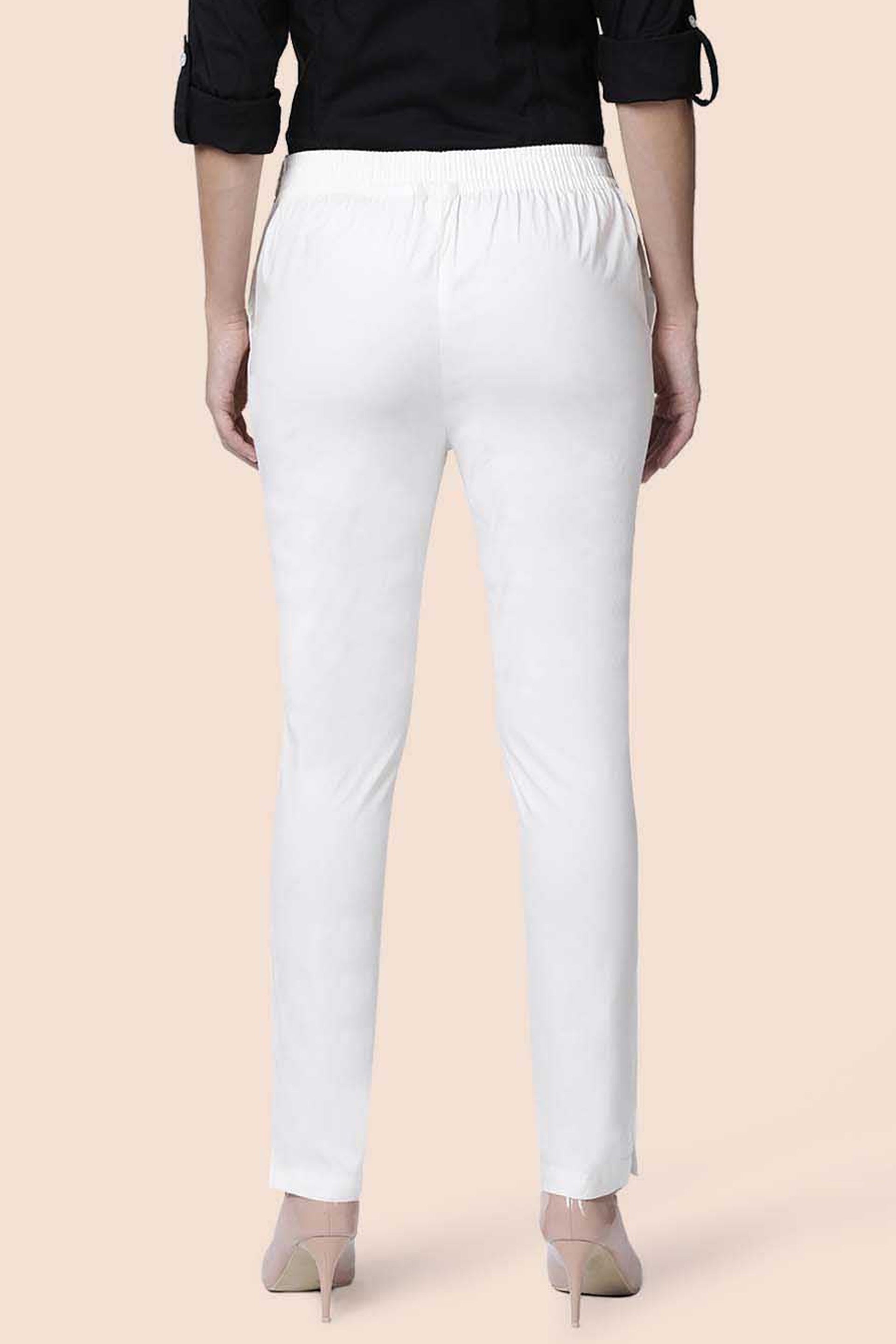 Back view of white straight pants for women with an elastic waistband and slim fit style