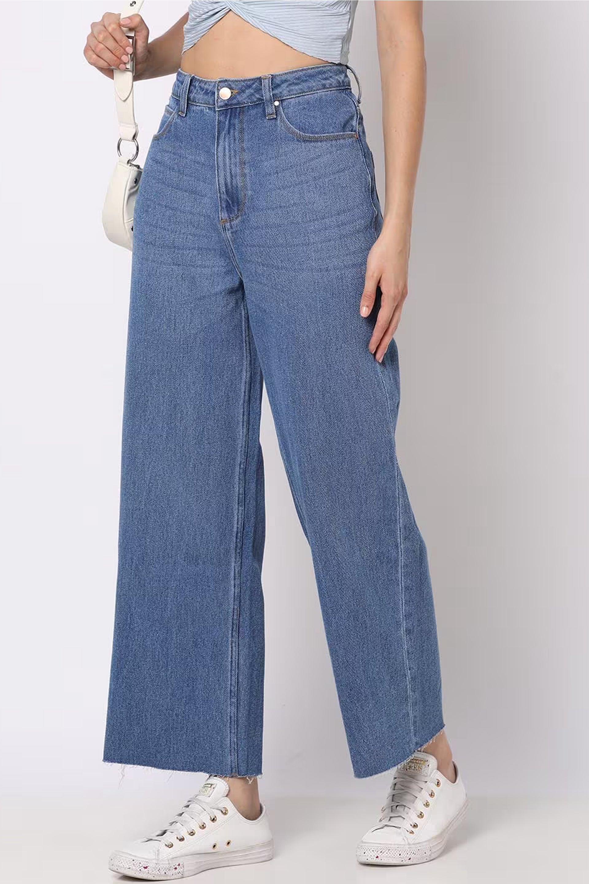 Women wide-leg jeans in light blue denim with high waist and relaxed fit for a trendy look