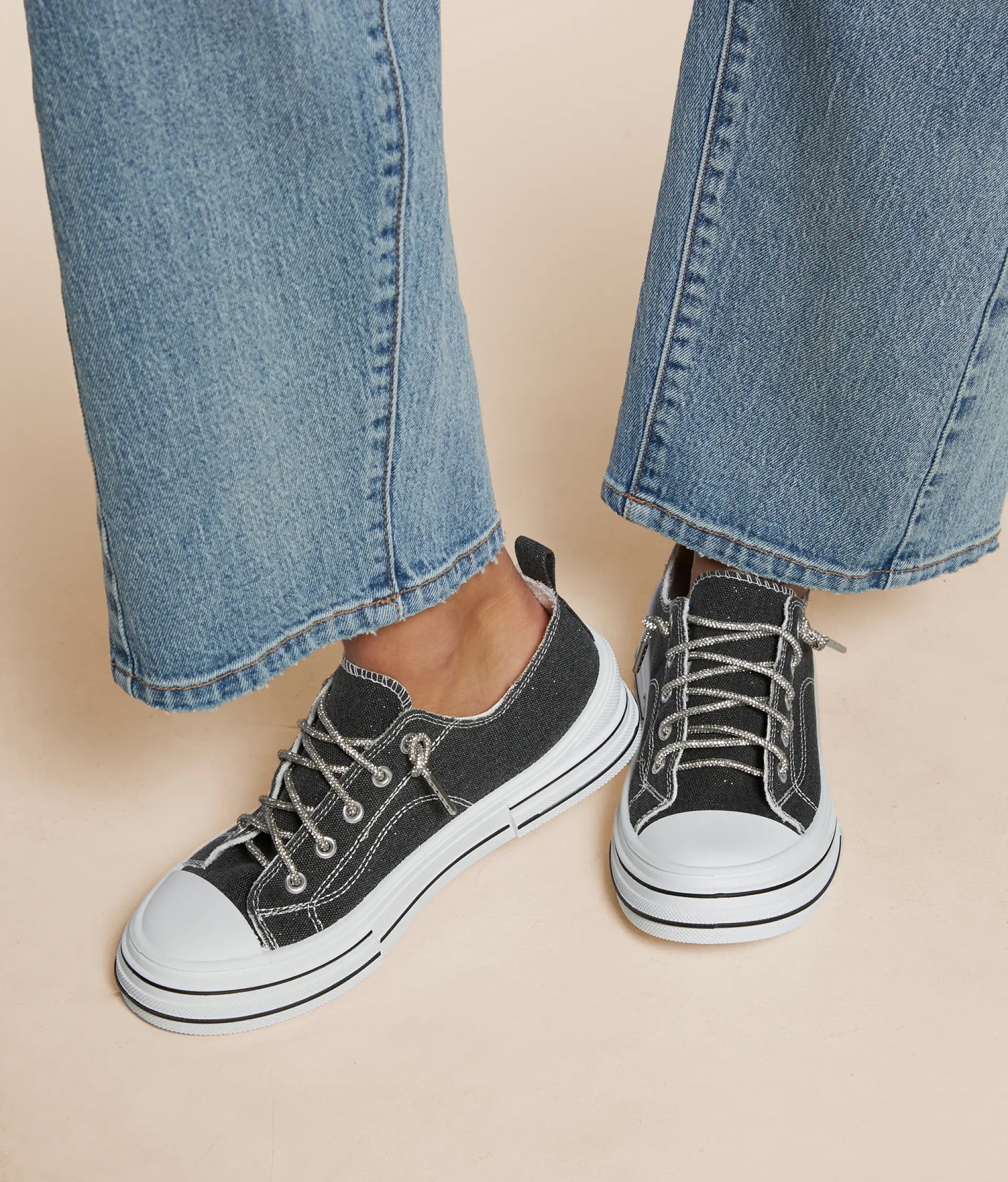 Women's black and white sneakers featuring a stylish design with lace-up closure and contrasting details